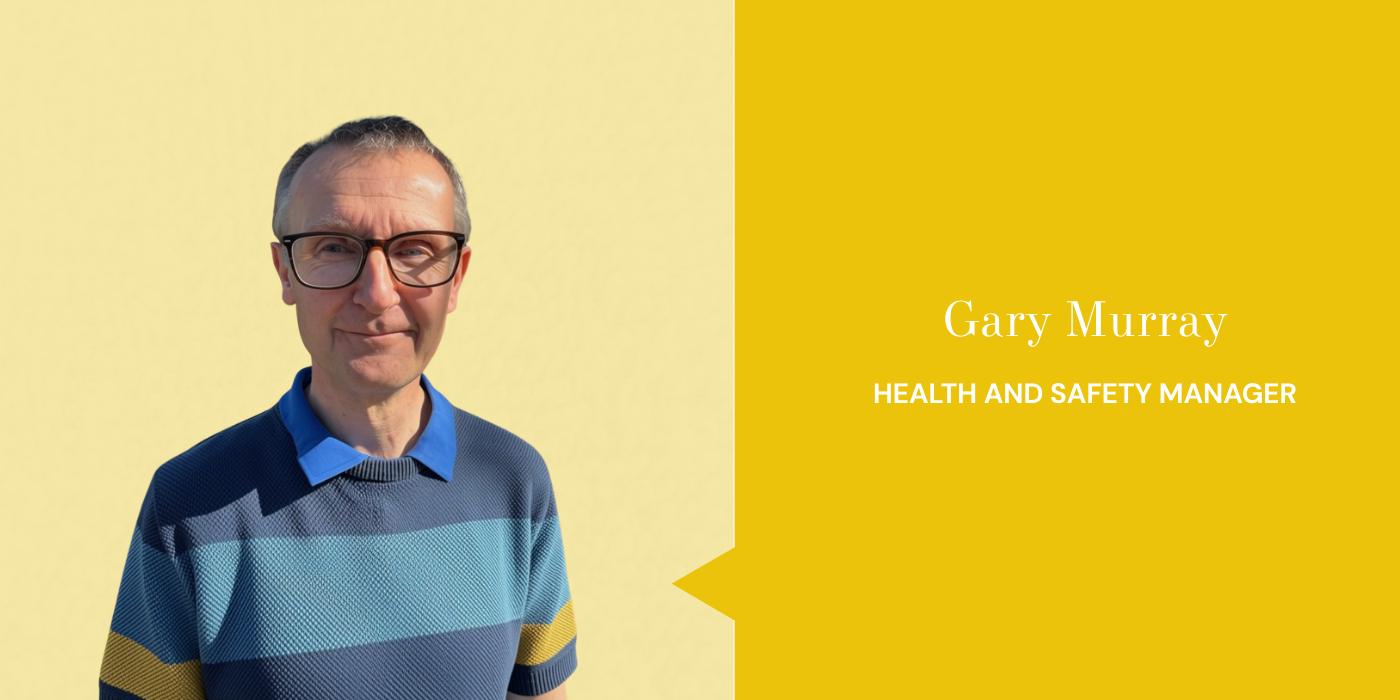 A man wearing glasses and a striped sweater standing outdoors with a yellow background, alongside a gold-colored panel with text reading 'Gary Murray, Health and Safety Manager'.