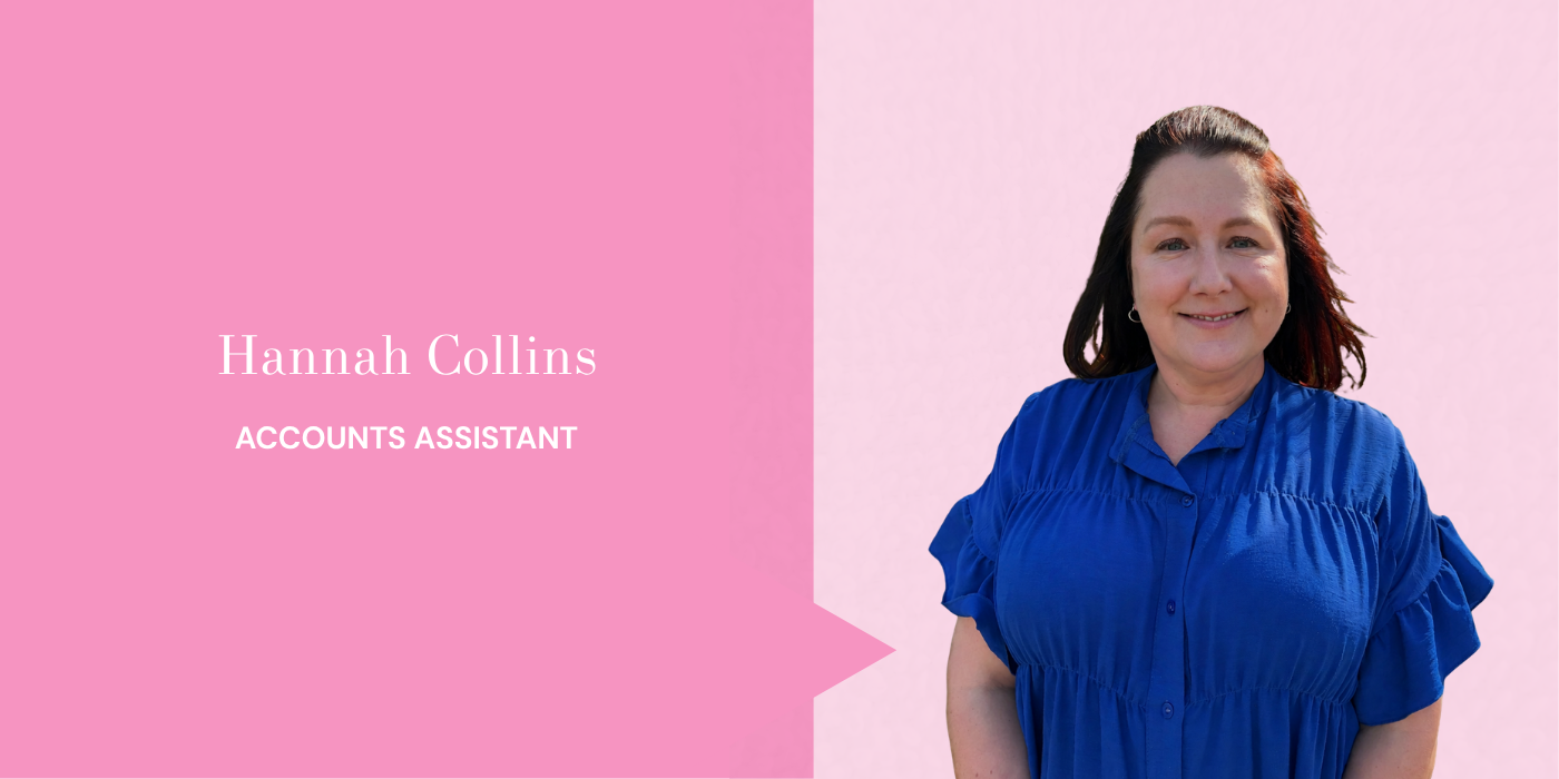 A woman with shoulder-length brown hair wearing a blue blouse, smiling, standing against a pink background with a pink and purple graphic section displaying her name and title.