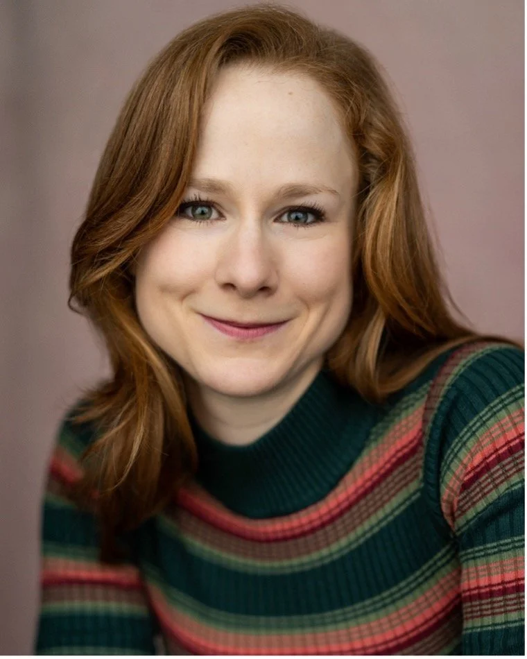 Headshot of Felicity Sparks wearing a striped jumper