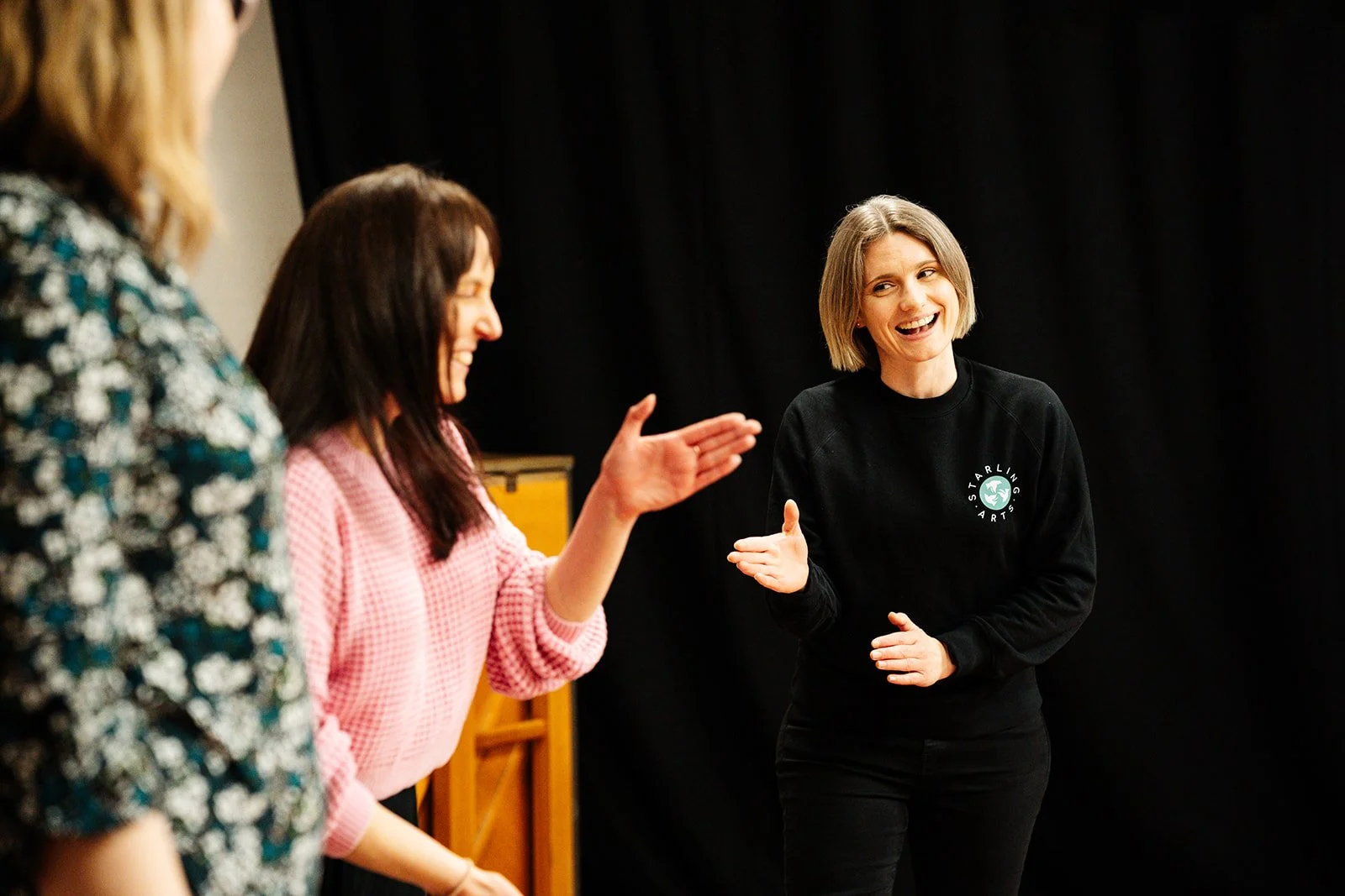 Anna Shields leading a warmup exercise in a Starling Arts rehearsal