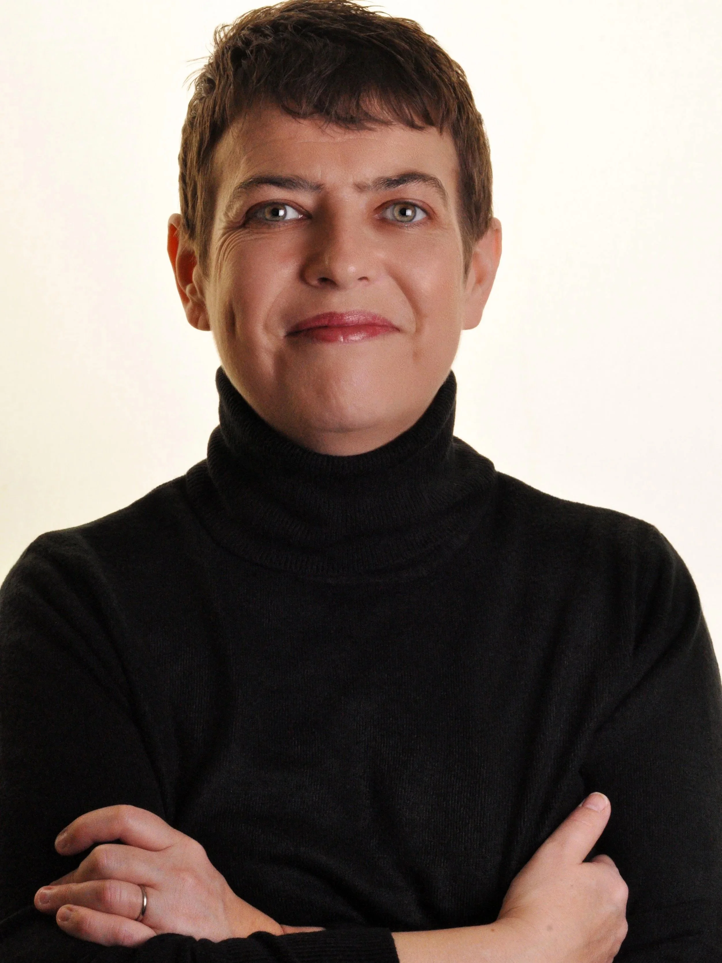 Headshot of Annemarie Lewis Thomas in a black rollneck jumper