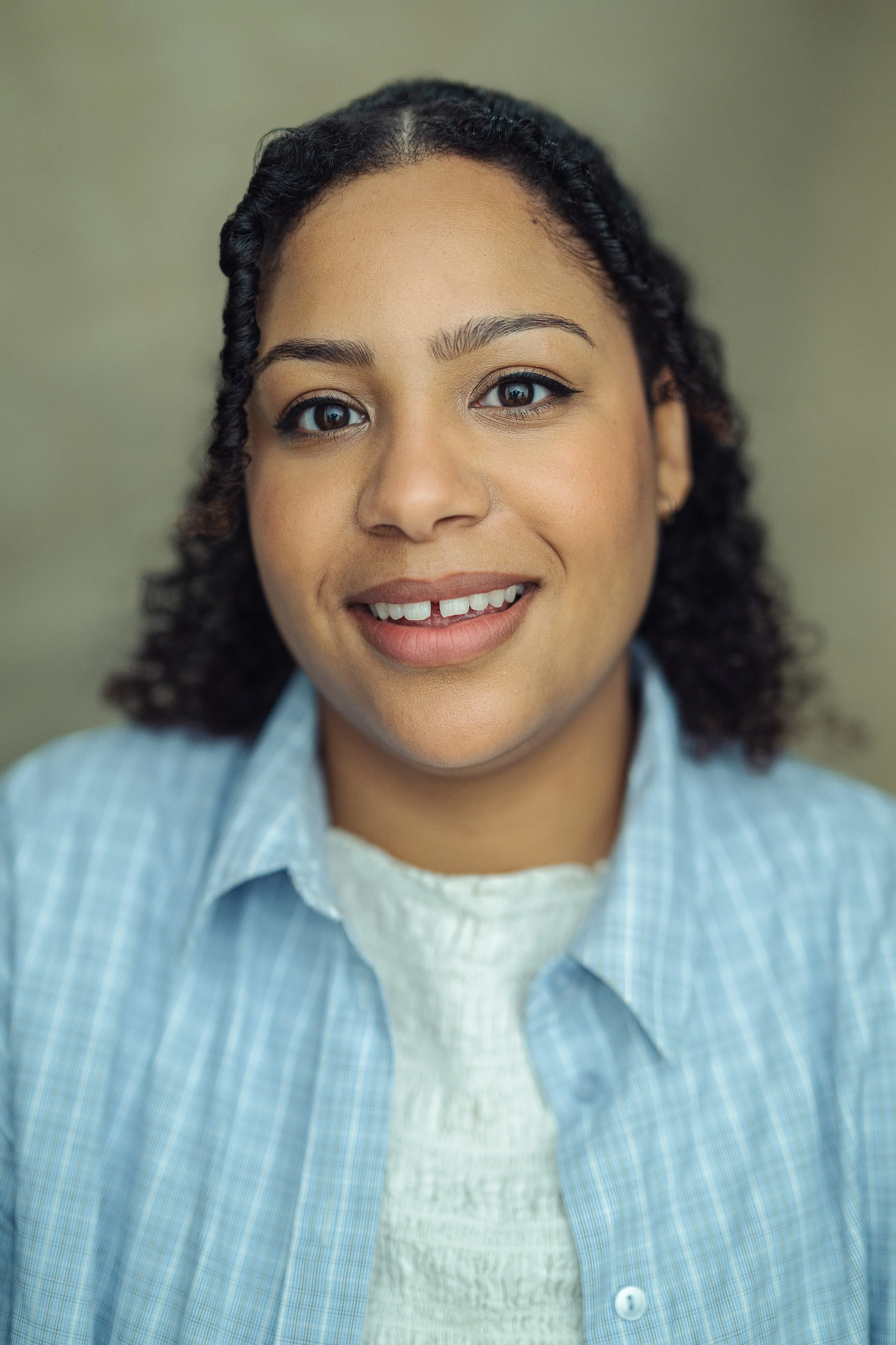 Headshot of Jade Johnson in a white top
