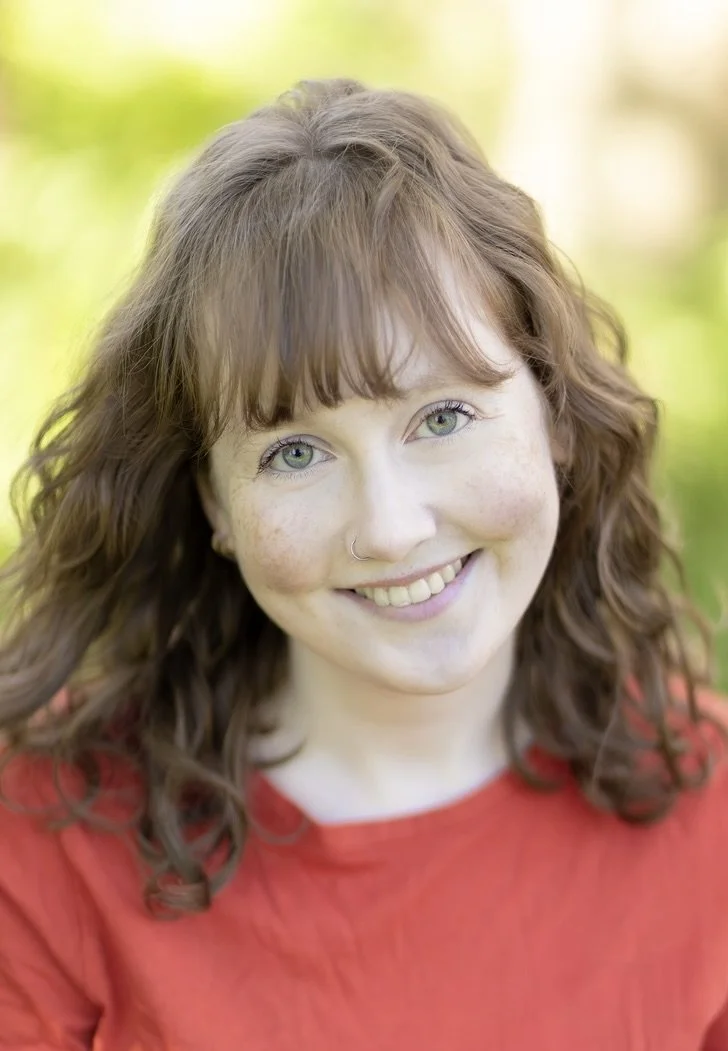 Headshot of Eliza Hemphill in a red t-shirt