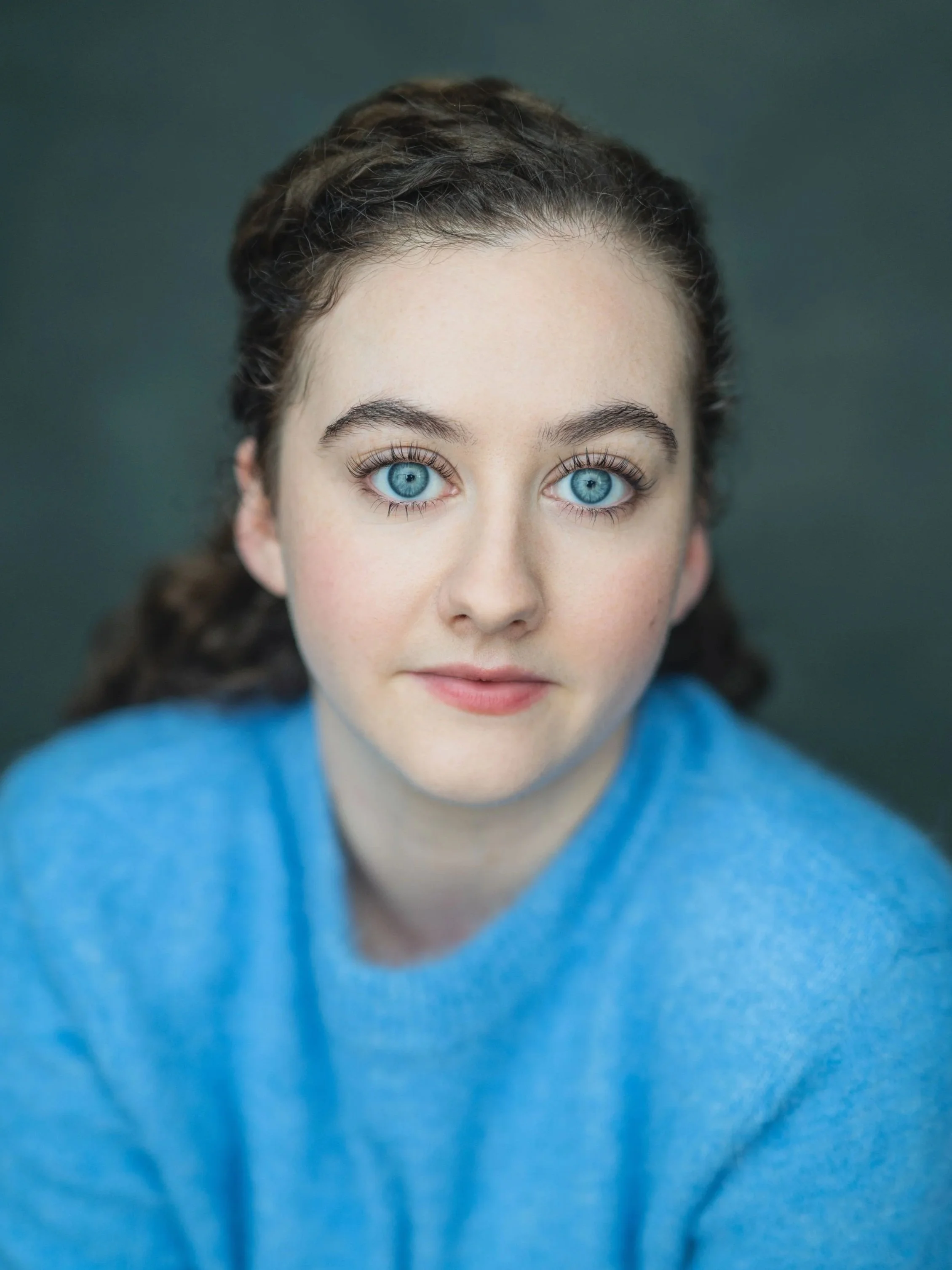Headshot of Claire Learie wearing a blue jumper