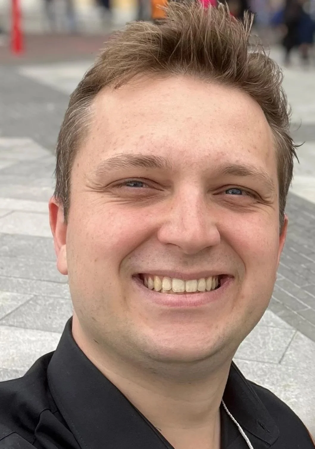 Headshot of Lawrence Michalowski in a black shirt