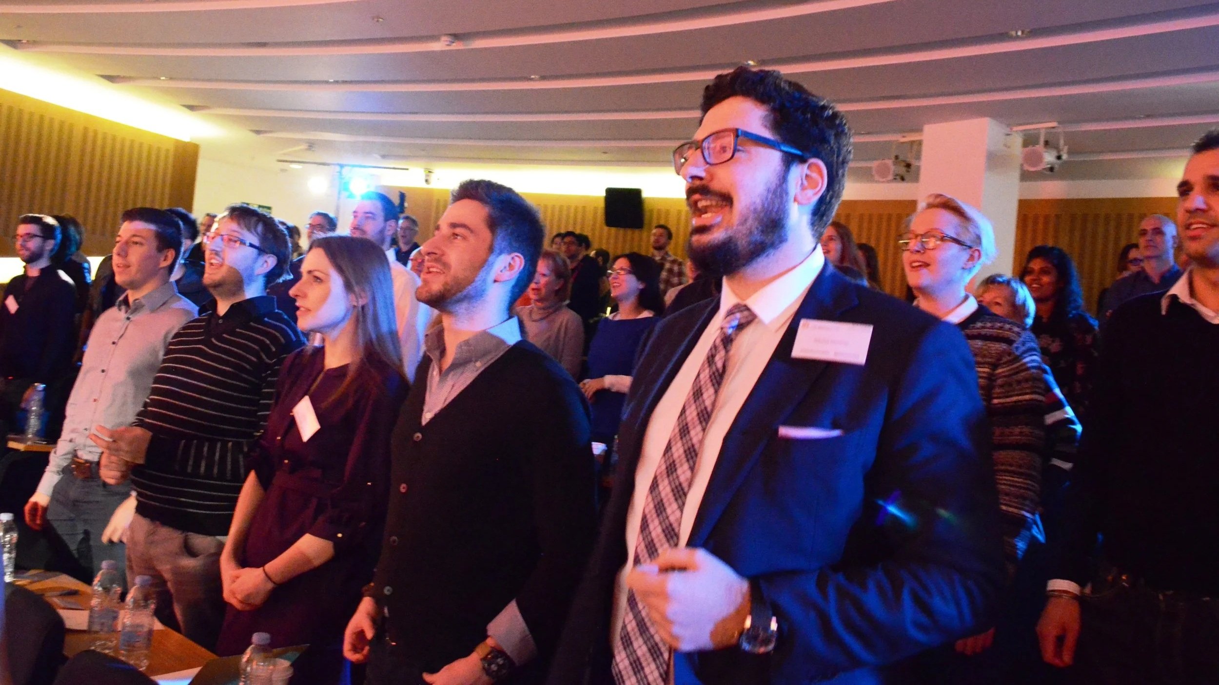 A group of conference delegates sing as part of a Starling Arts workshop