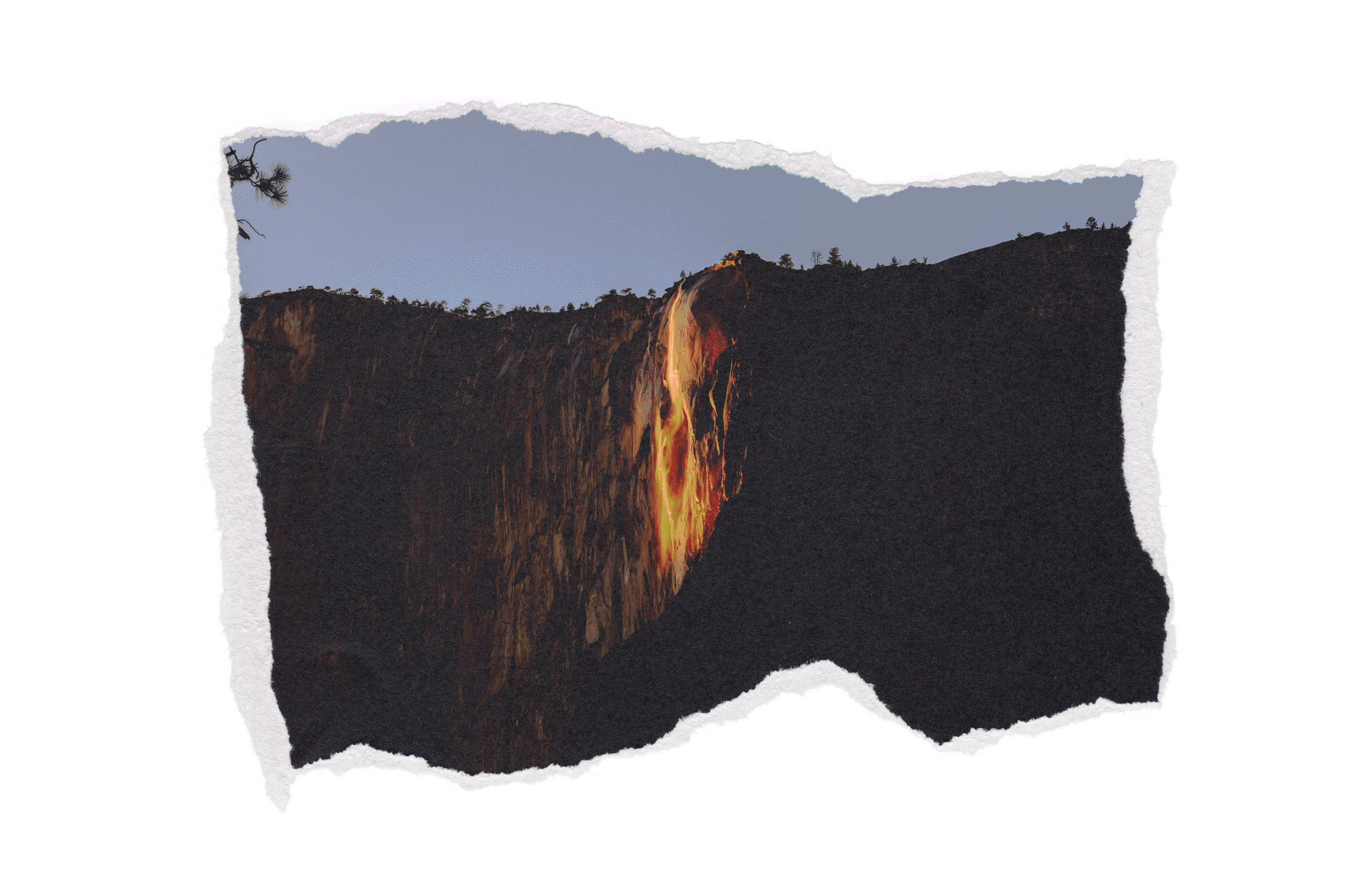 Image of a waterfall on a black mountain with trees at the top and a mountain range in the background.