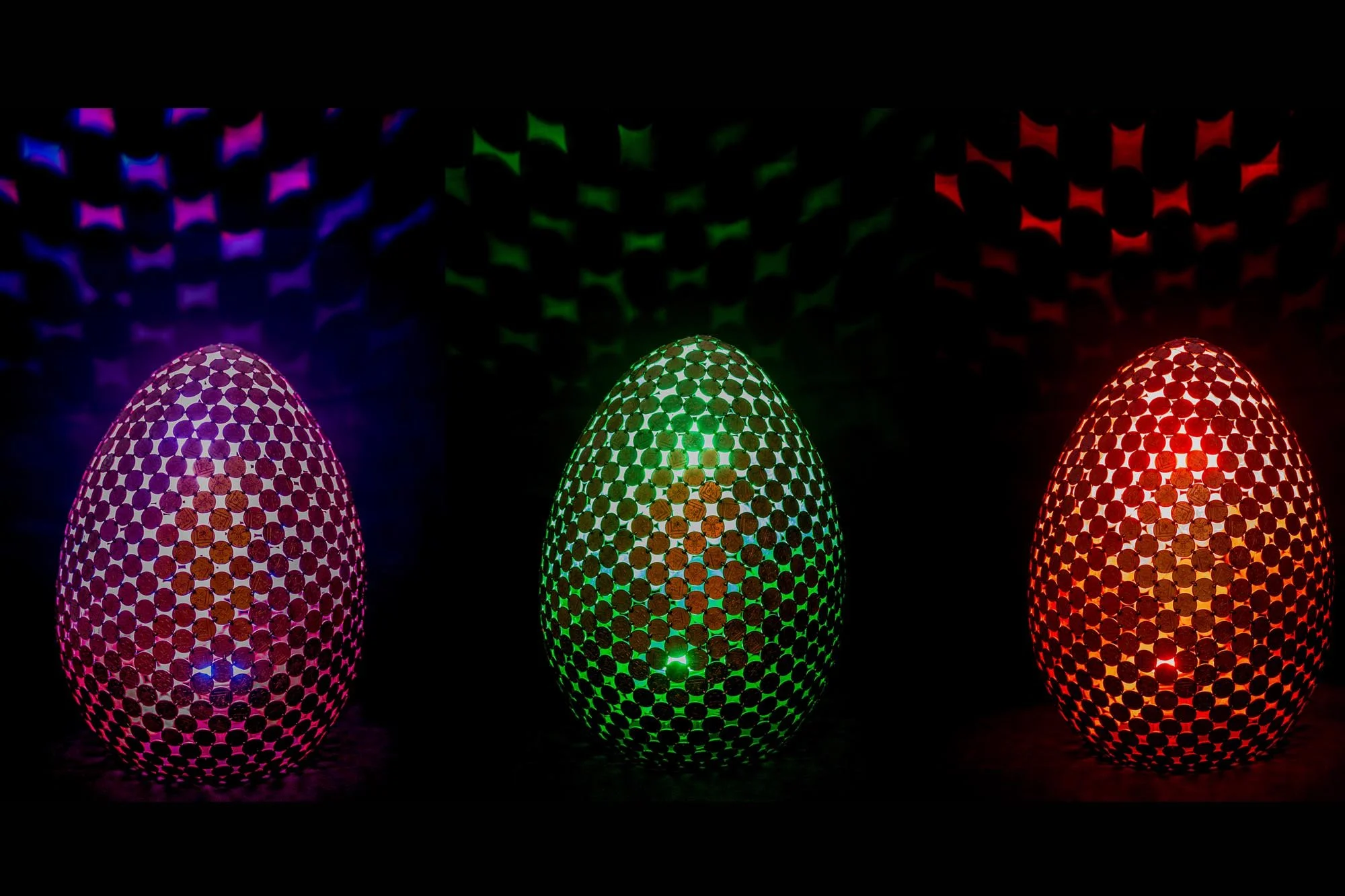 Egg Lamps are large egg-shaped sculptures made from welded 2p coins that emit light with a color-changing controller. Handmade by Shaun Gagg, each piece may vary, and customizations are available.