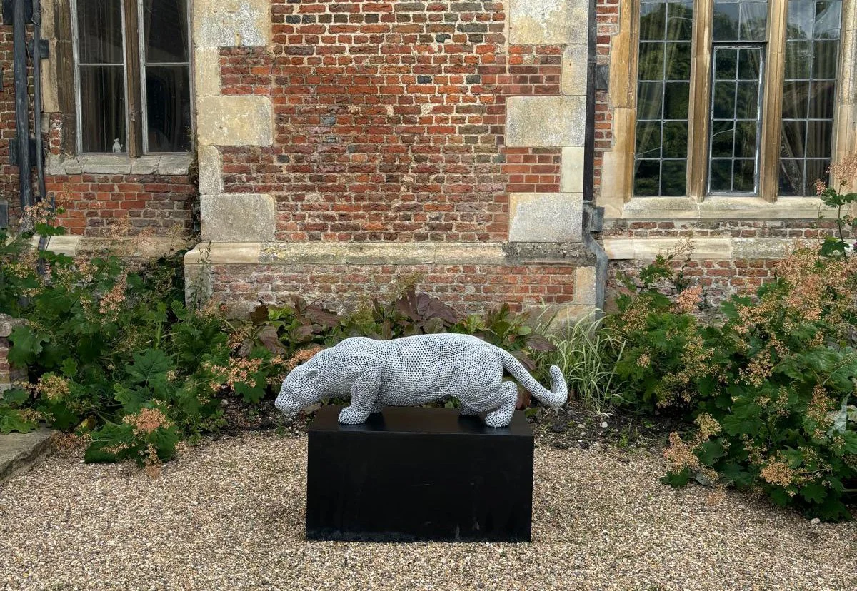 a jaguar made from over 7000 metal nuts and 17,000 individual welds it has been liquid galvanised then powder coated to a silver colour to protect it from the elements so it will not rust
