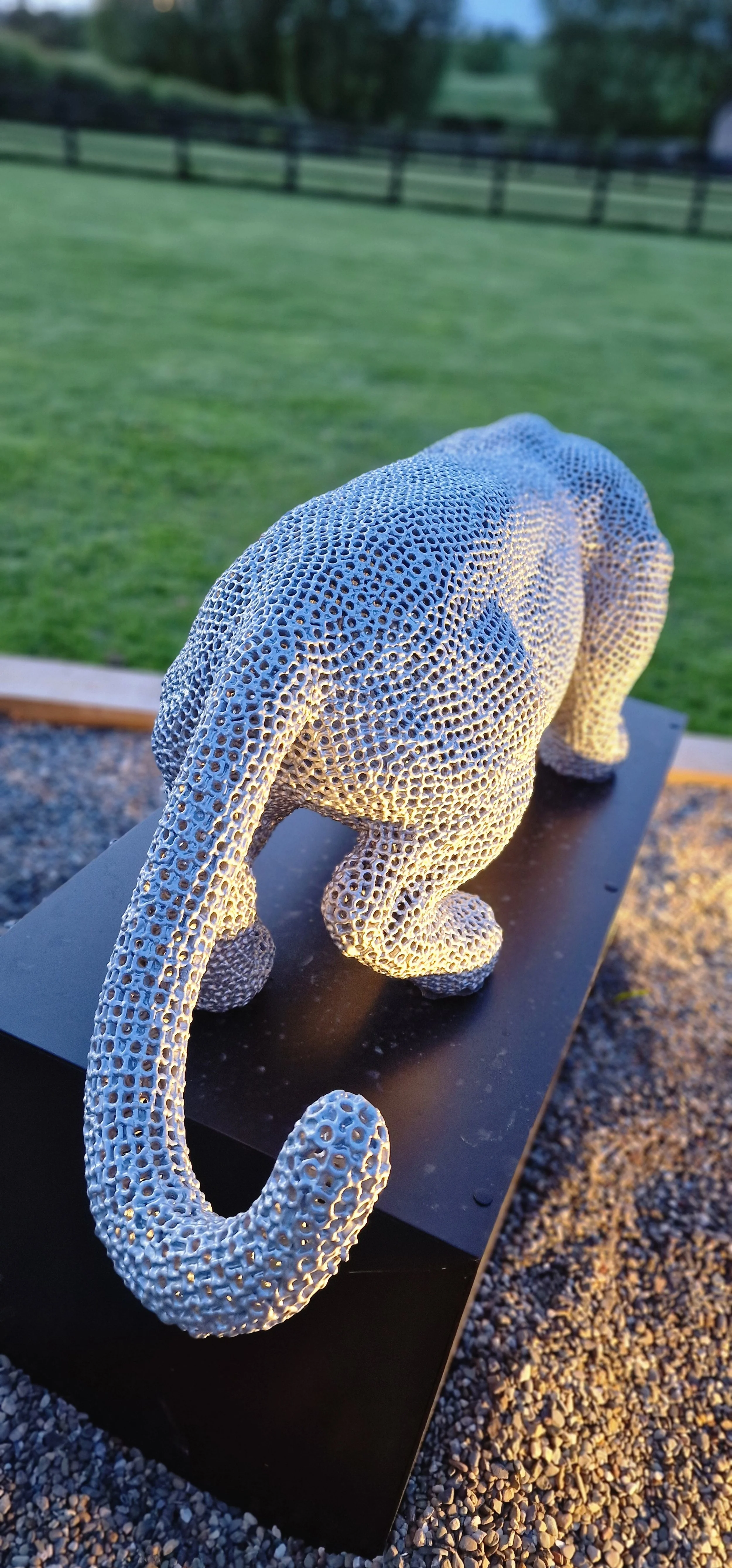 a jaguar made from over 7000 metal nuts and 17,000 individual welds it has been liquid galvanised then powder coated to a silver colour to protect it from the elements so it will not rust