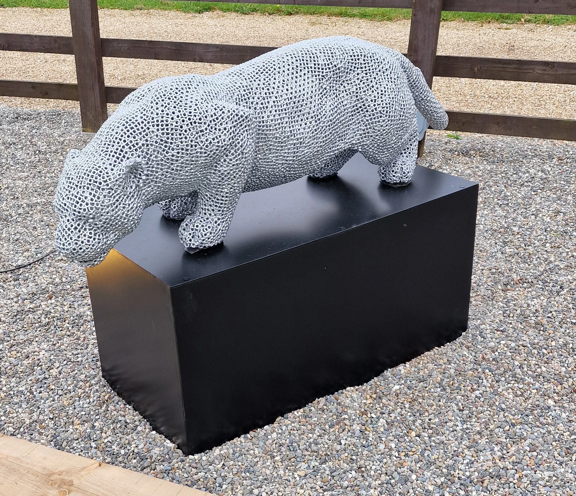 a jaguar made from over 7000 metal nuts and 17,000 individual welds it has been liquid galvanised then powder coated to a silver colour to protect it from the elements so it will not rust