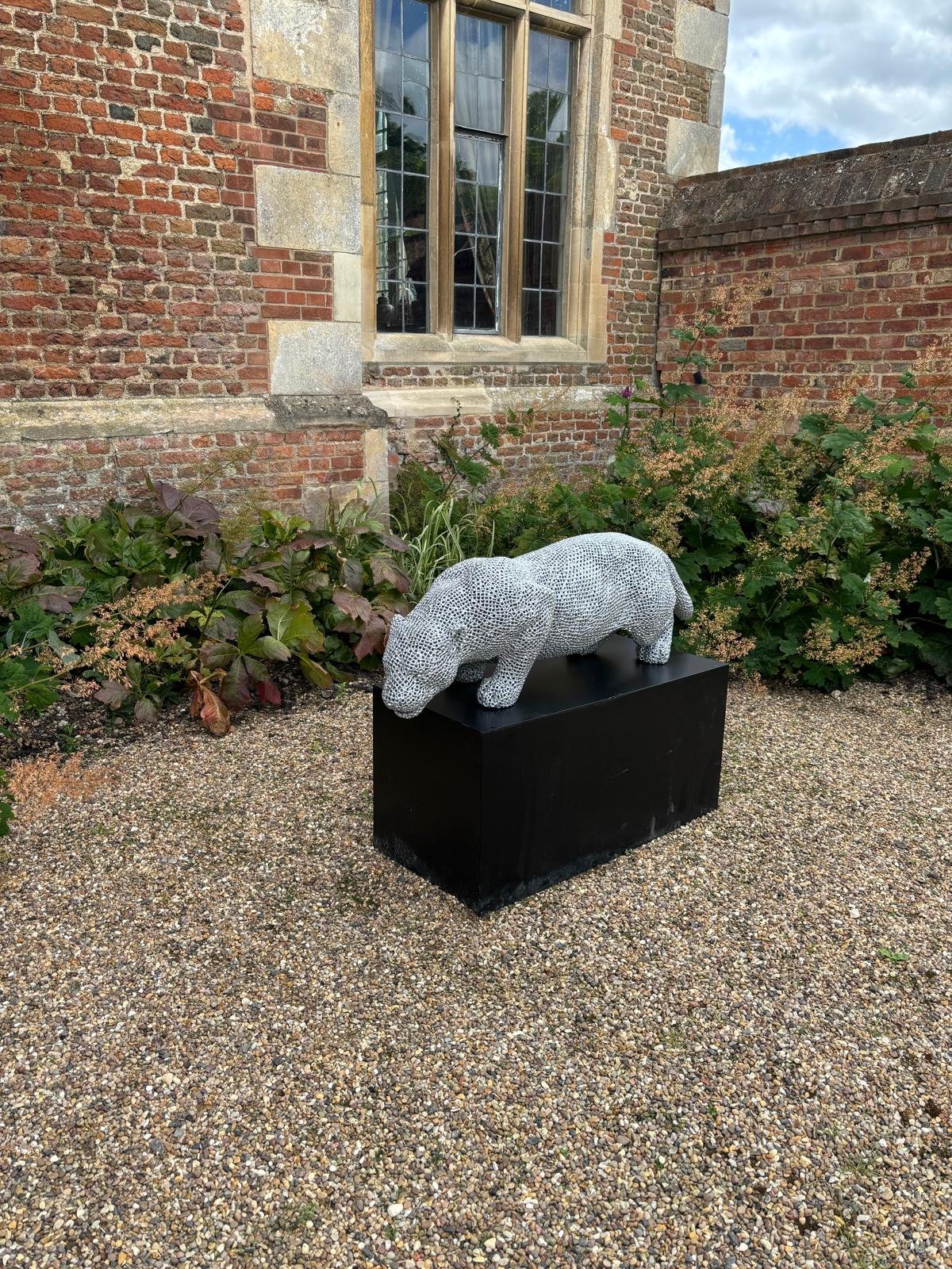 a jaguar made from over 7000 metal nuts and 17,000 individual welds it has been liquid galvanised then powder coated to a silver colour to protect it from the elements so it will not rust