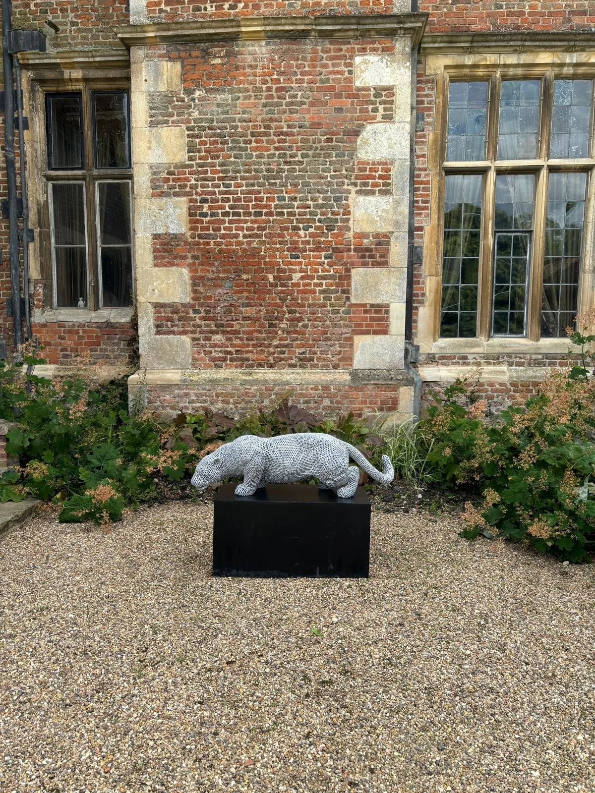 a jaguar made from over 7000 metal nuts and 17,000 individual welds it has been liquid galvanised then powder coated to a silver colour to protect it from the elements so it will not rust
