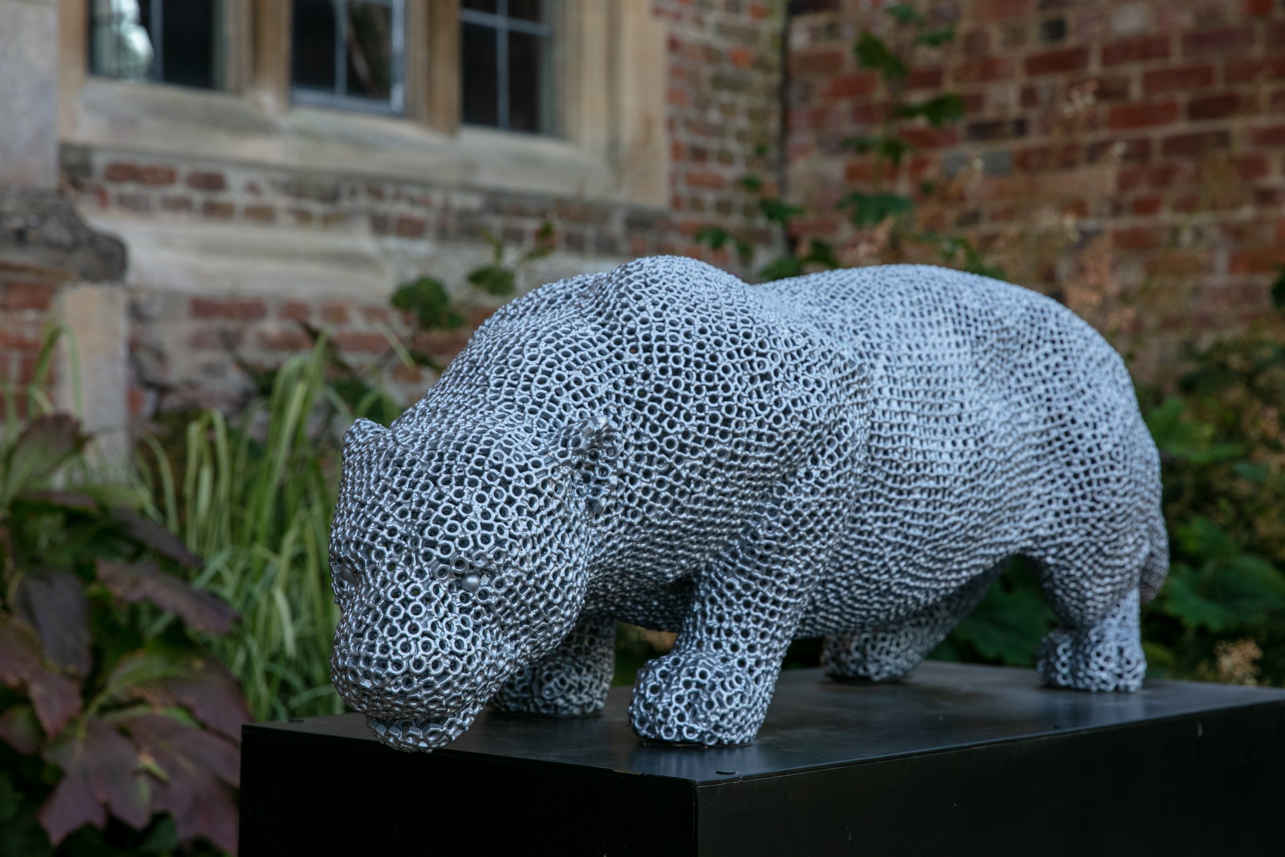 a jaguar made from over 7000 metal nuts and 17,000 individual welds it has been liquid galvanised then powder coated to a silver colour to protect it from the elements so it will not rust