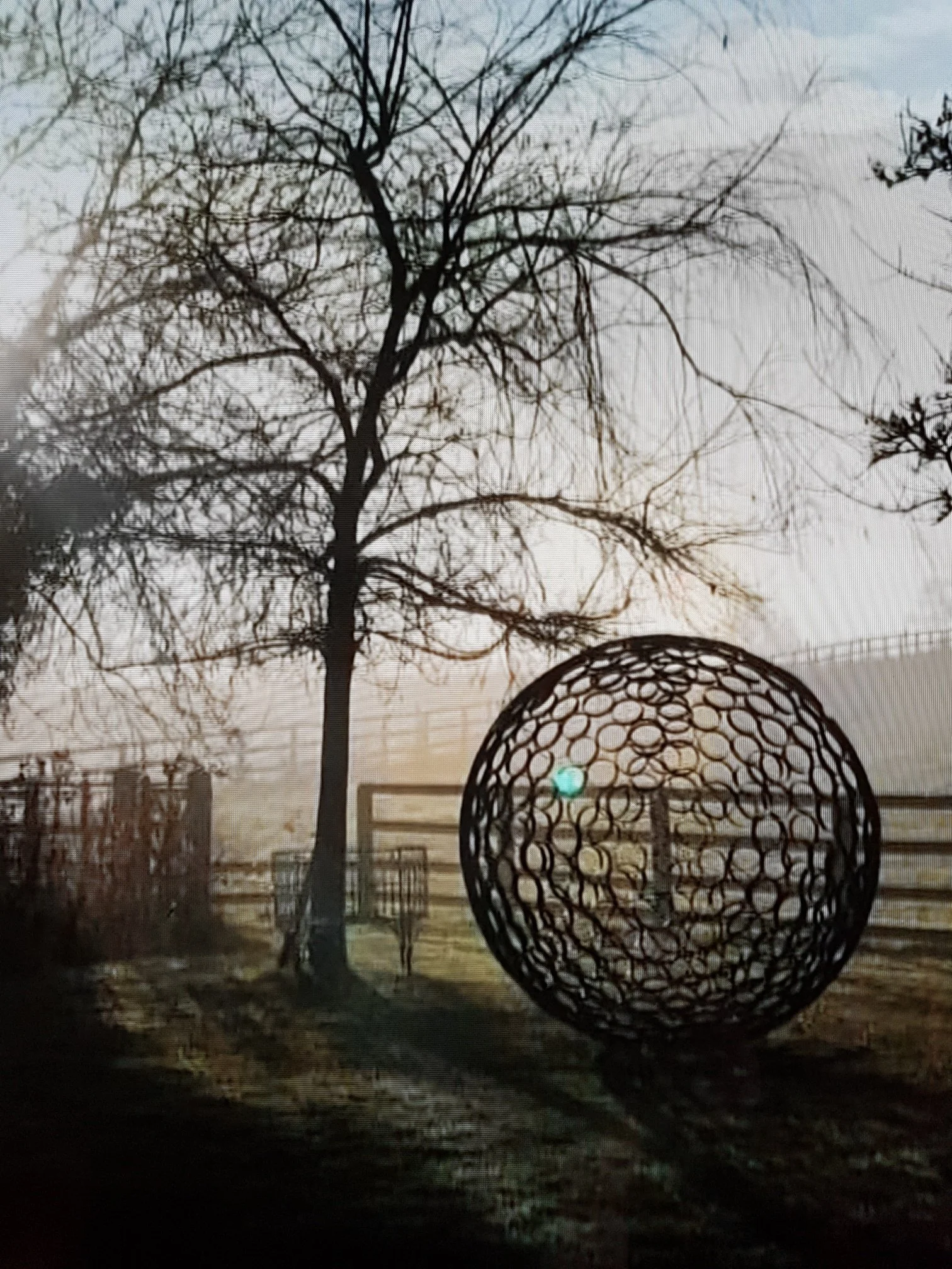 This sculpture is a sphere. Crafted by cutting steel pipes into slices and welding them together from the inside.  Note: The sphere will eventually rust over time.