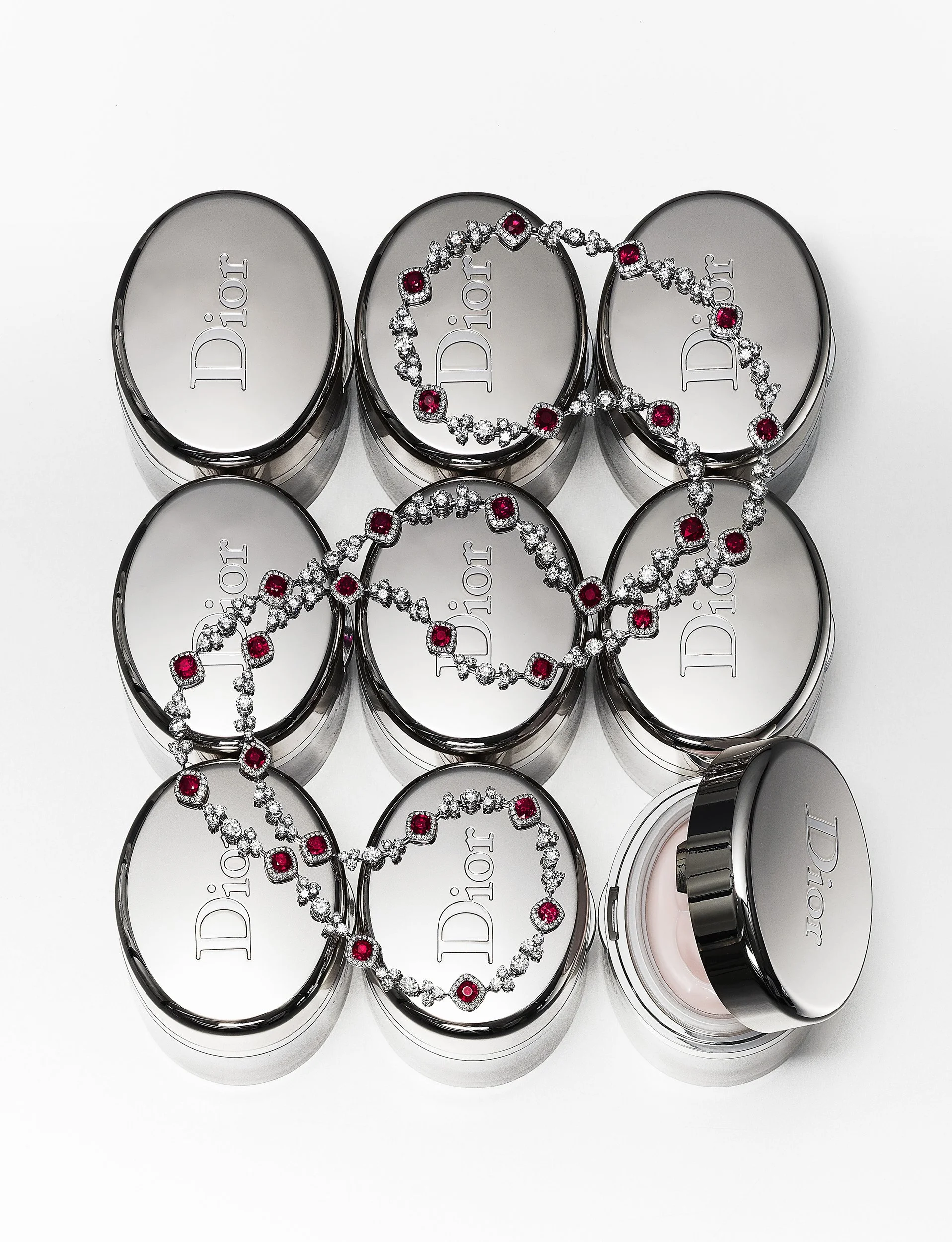 Still Life photograph by photographer Paul Zak of Dior face cream and Dior designer jewellery