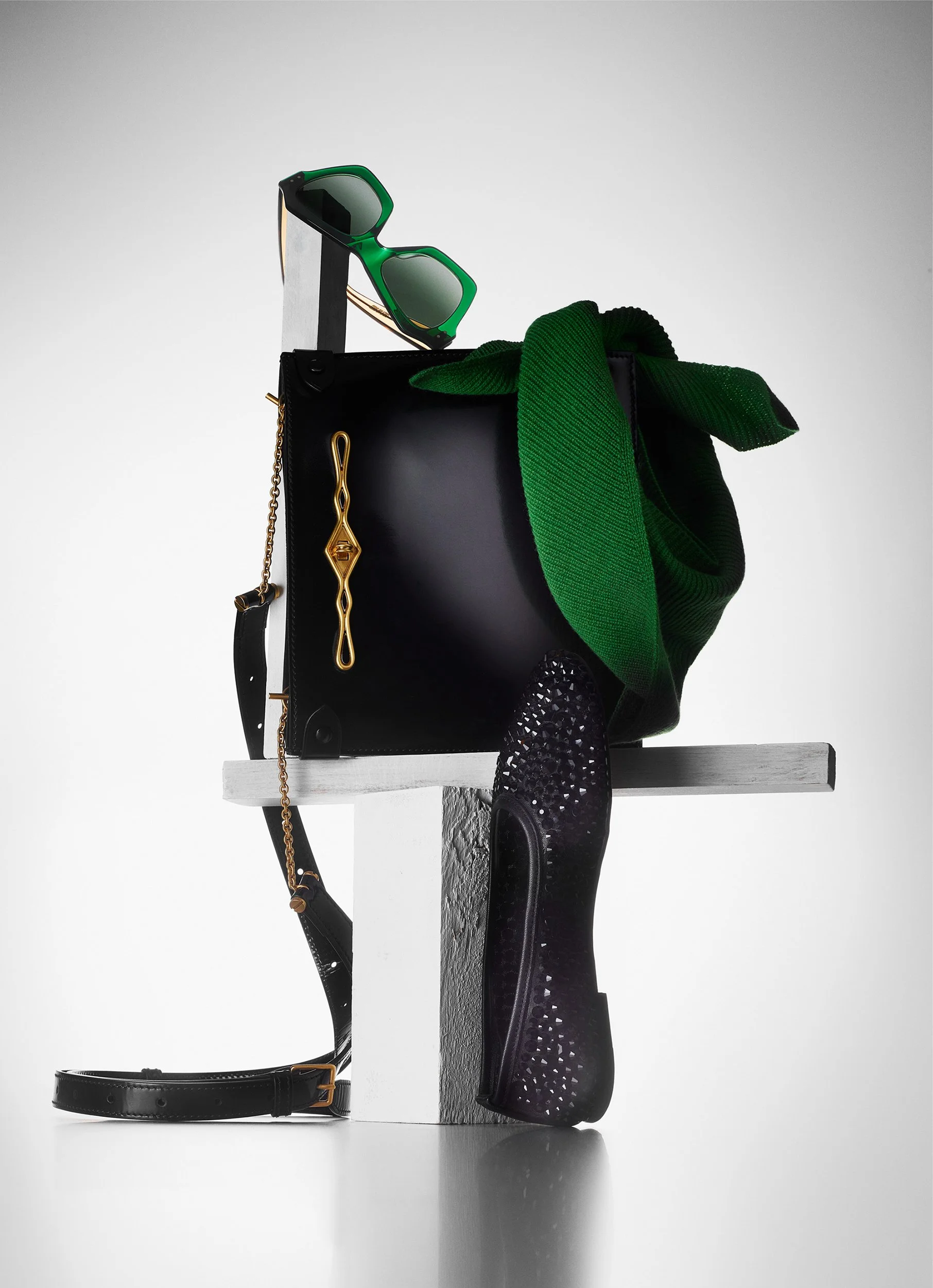 Still Life photograph by photographer Paul Zak of a bag, sunglasses and scarf for Telegraph Luxury Magazine.