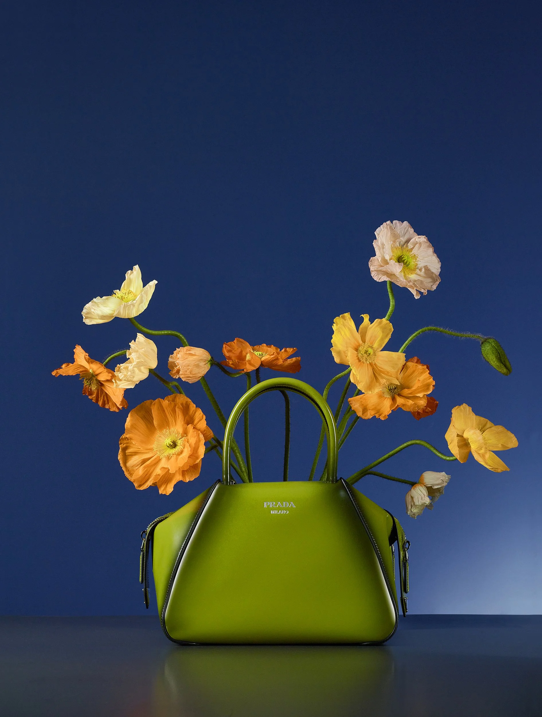 Still Life photograph by photographer Paul Zak of a Prada designer handbag with flowers for Bazaar UK