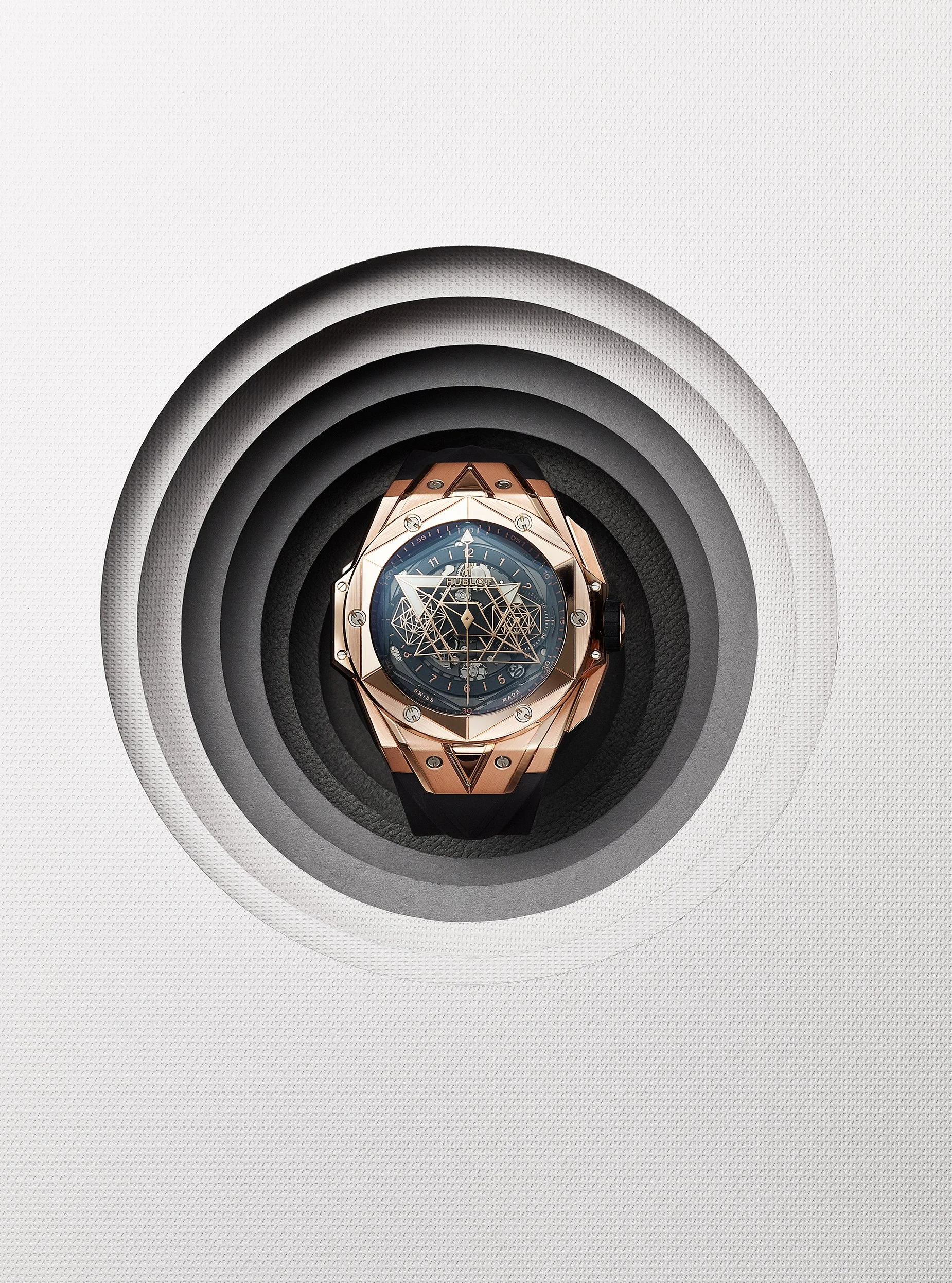 Still Life photograph by photographer Paul Zak of a Hublot designer watch set in paper art set for Mens Health Magazine
