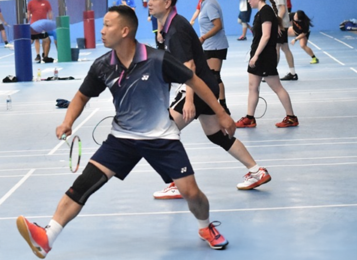 Man playing badminton