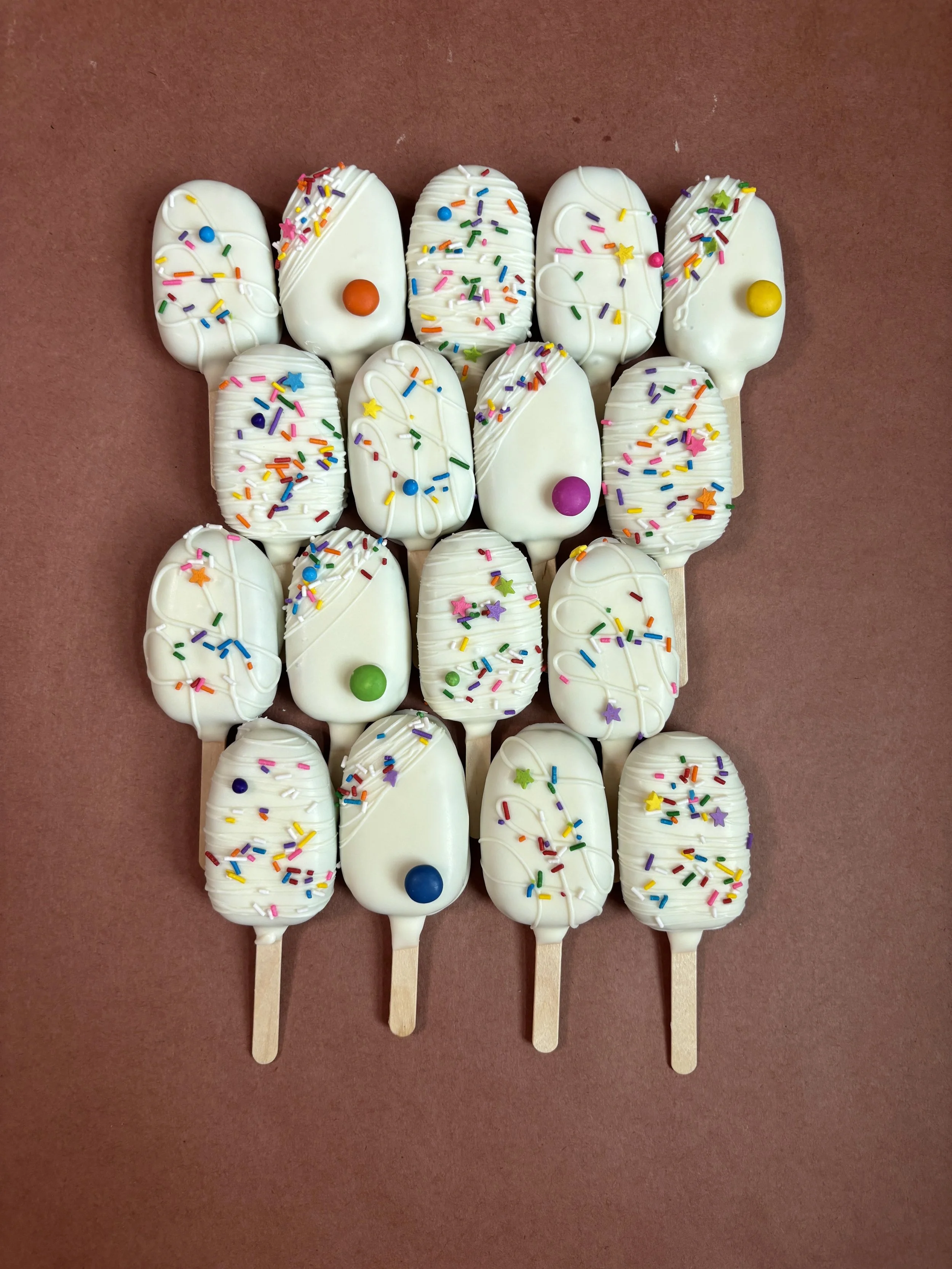 Funfetti. Our classic Funfetti dough made with fancy rainbow mix and topped with a vanilla candy coating and more sprinkles .