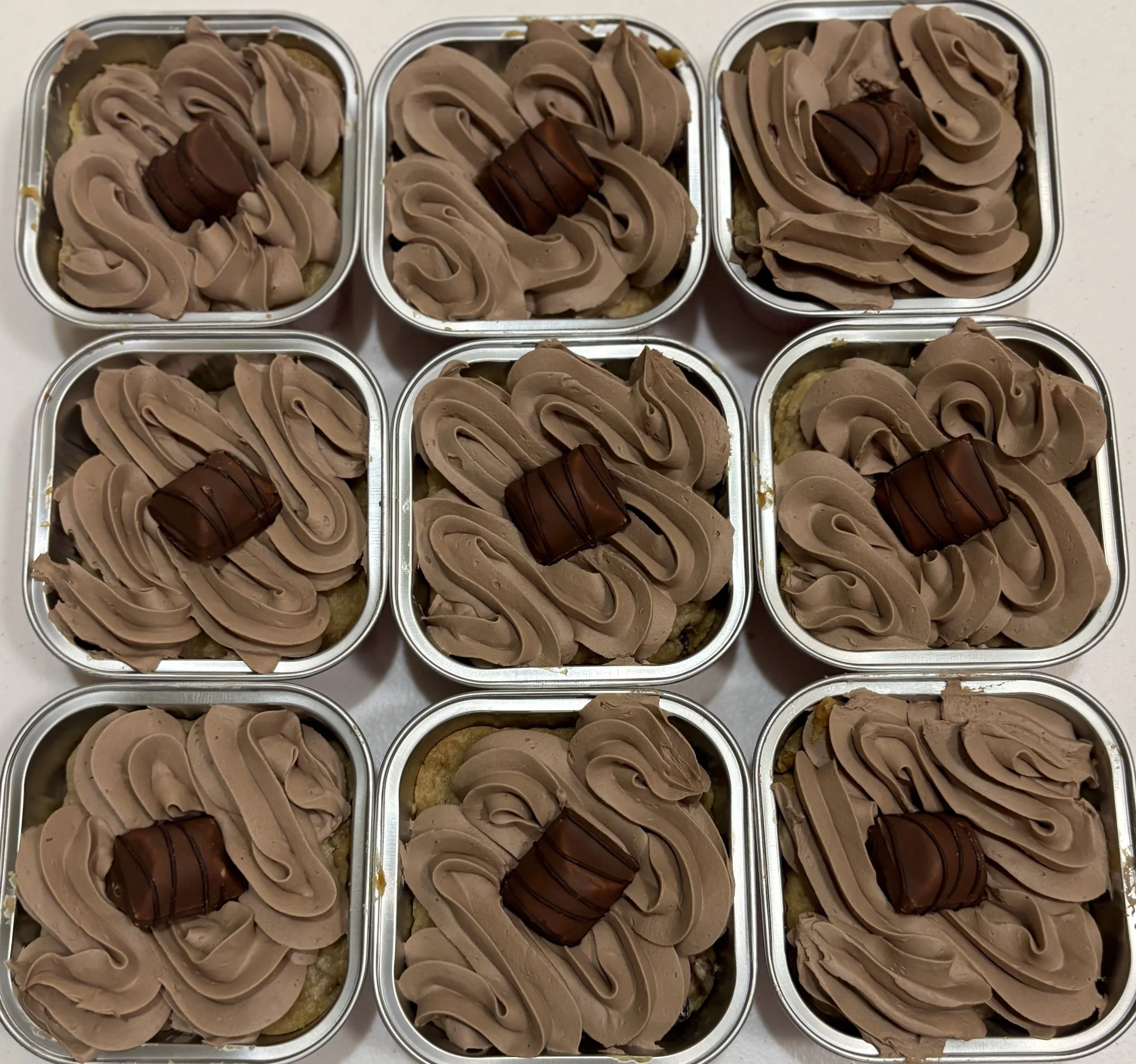 Our kinder bueno cookie cakes. Delicious bueno cookie stuffed with a hazelnut filling and topped with chocolate butter cream and a mini kinder bueno. 
