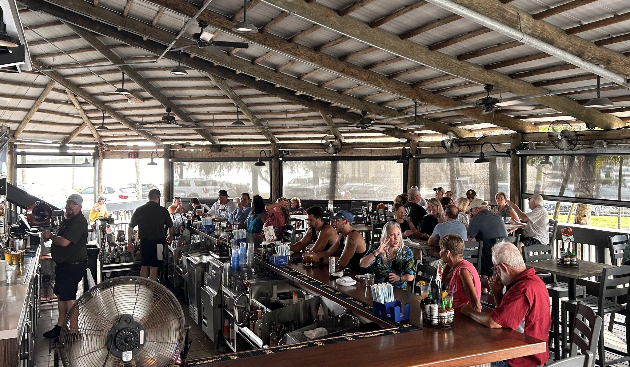 Everyone has their go-to spot. Ours just happens to come with waterfront views and a fully stocked bar. 😉