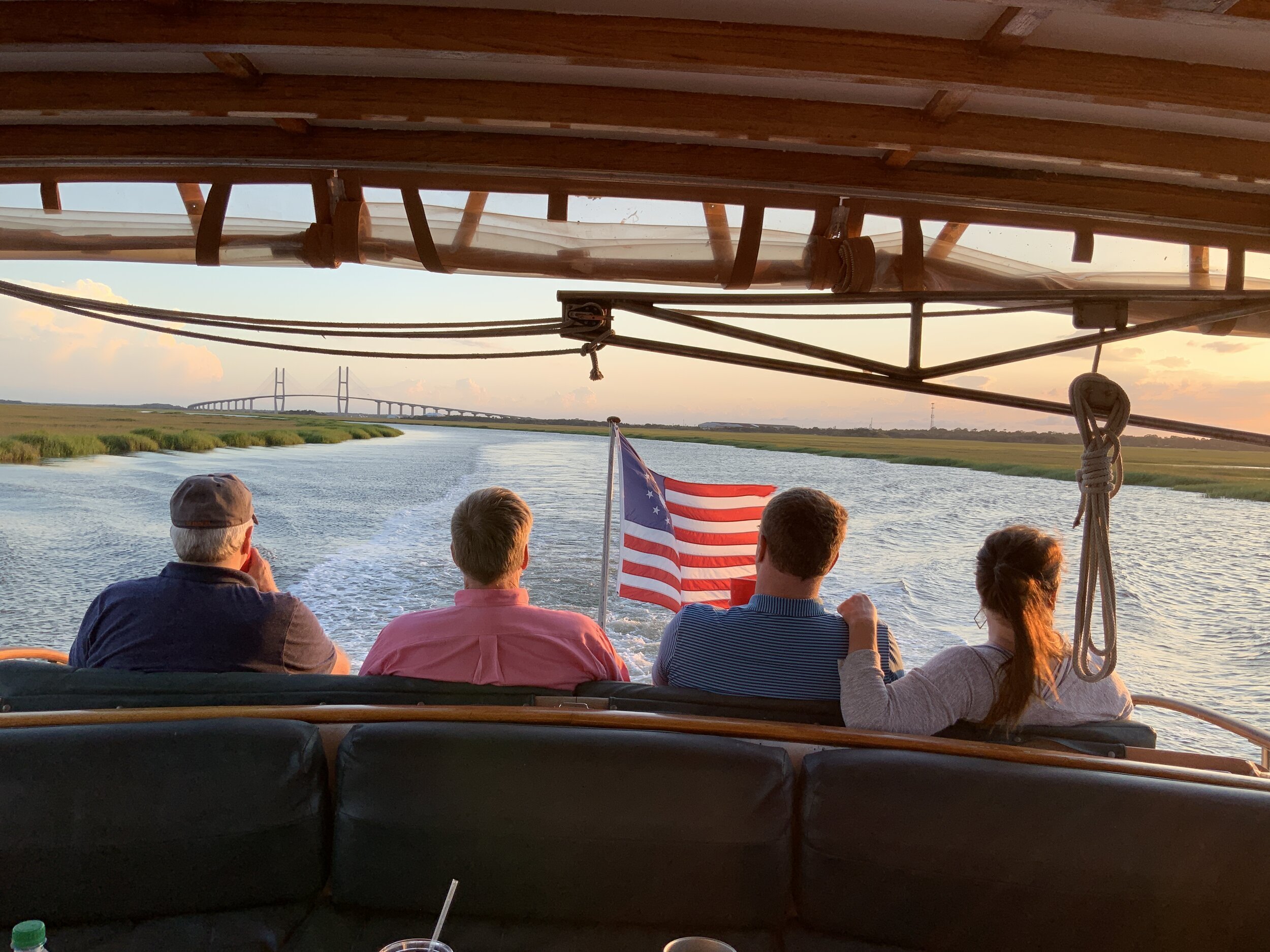 Guests watching the sunset from the aft deck of the String of Pearls
