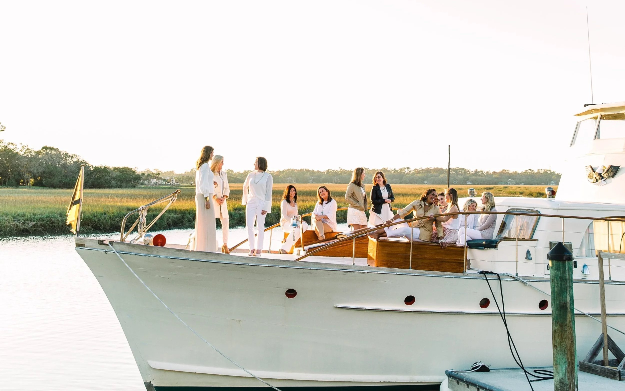 Wedding party on the bow of the String of Pearls at the dock