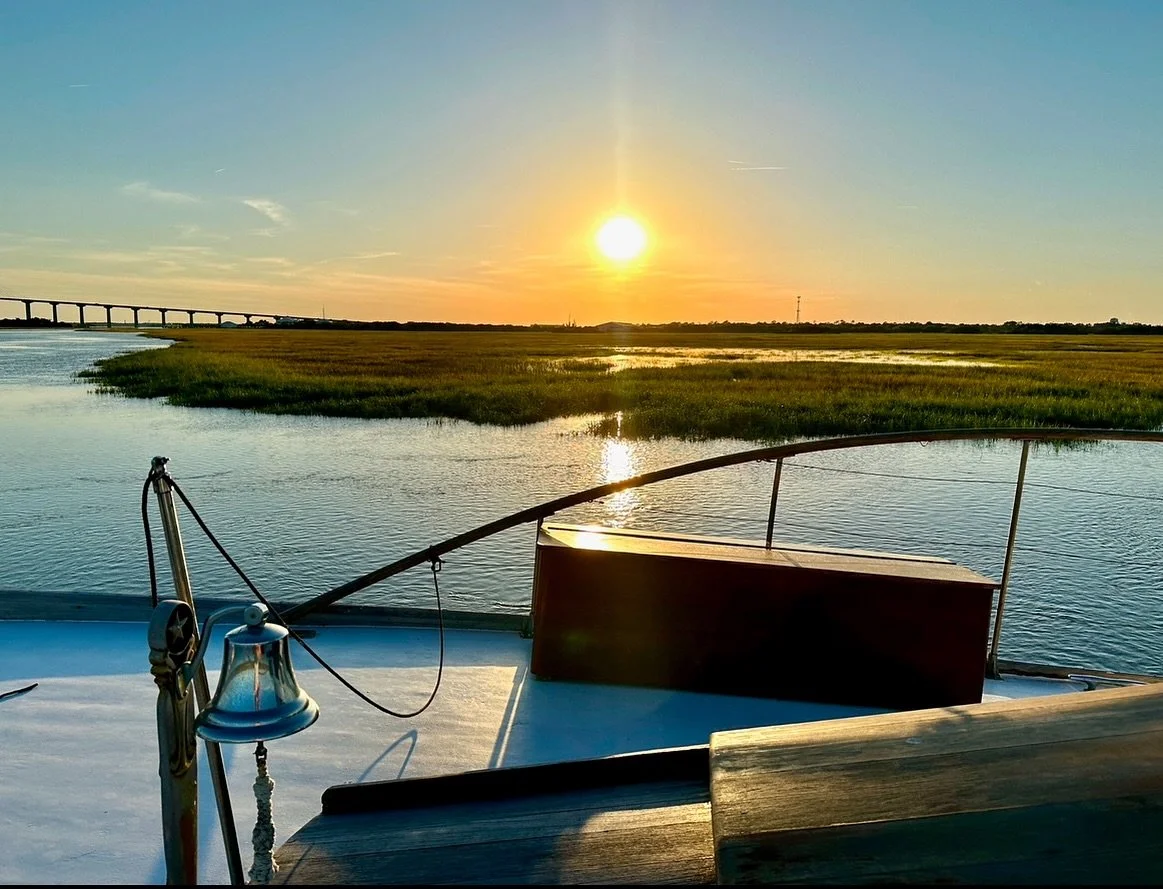 Sun setting over the marsh, viewed from the deck of the String of Pearls