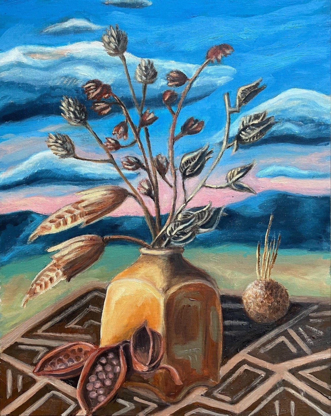 A painting of a still life scene with a brown jar holding dried branches and leaves, a small round textured object, a couple of open pods with seeds, all on a patterned tablecloth. In the background, a landscape with dark mountains and a colorful sky with clouds.