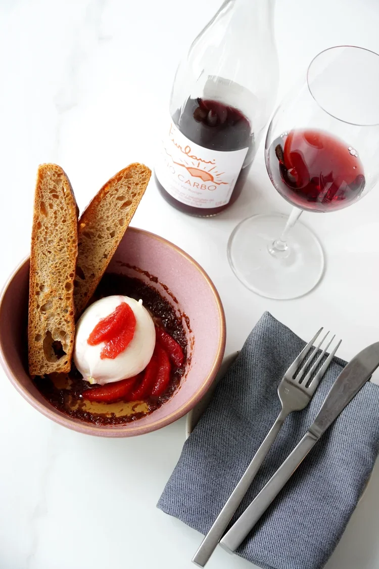 Elmore Mountain Bread focaccia with local burrata, jam and natural wine at Cork Restaurant in Stowe, Vermont
