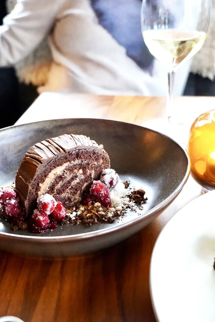 Seasonal chocolate dessert cake with pomegranate at Cork Restaurant — farm-to-table dining in Stowe, Vermont