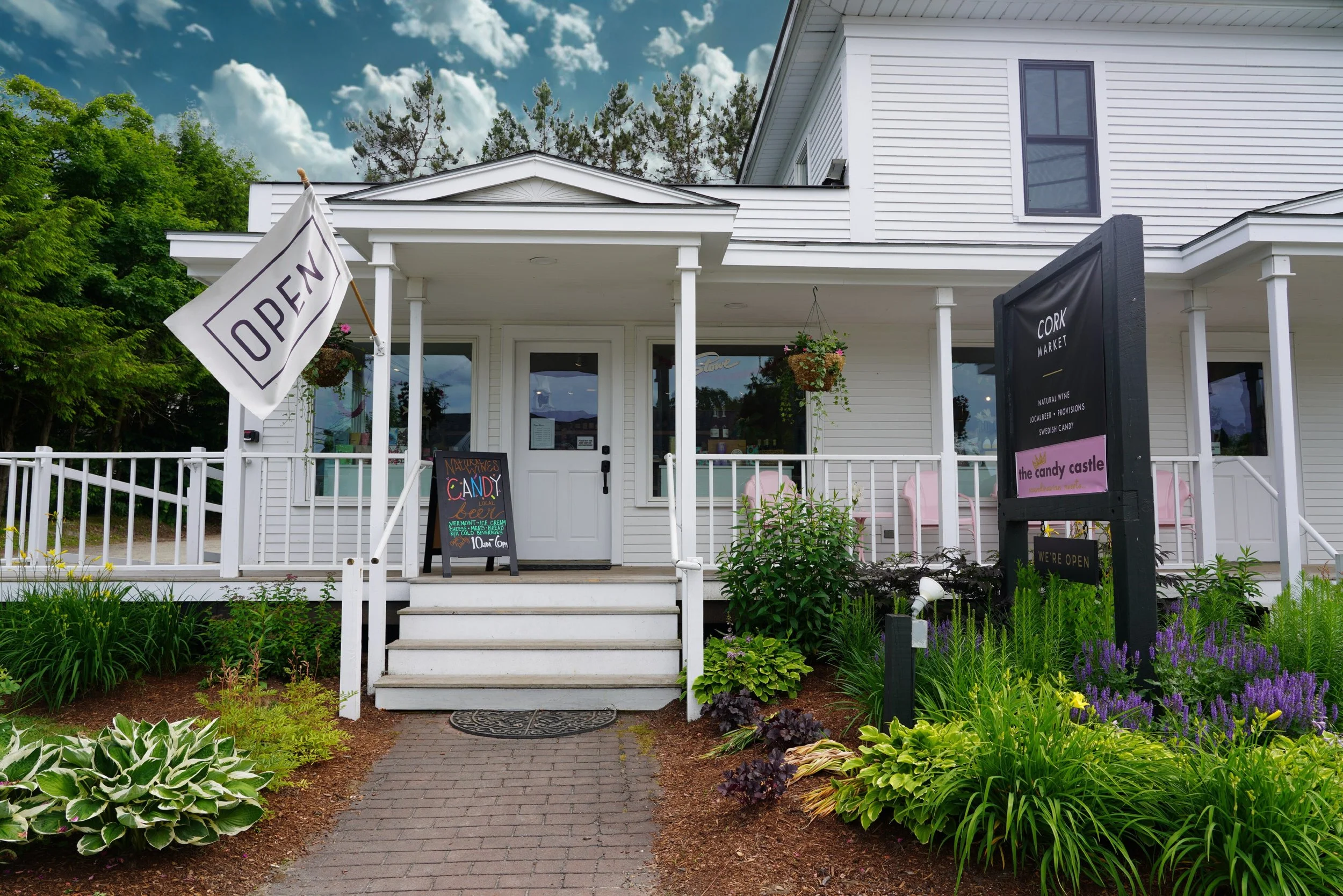 Exterior of Cork Market & The Candy Castle on Pond Street in Stowe, Vermont. Featuring natural wine, local beer, Swedish candy, and provisions.
