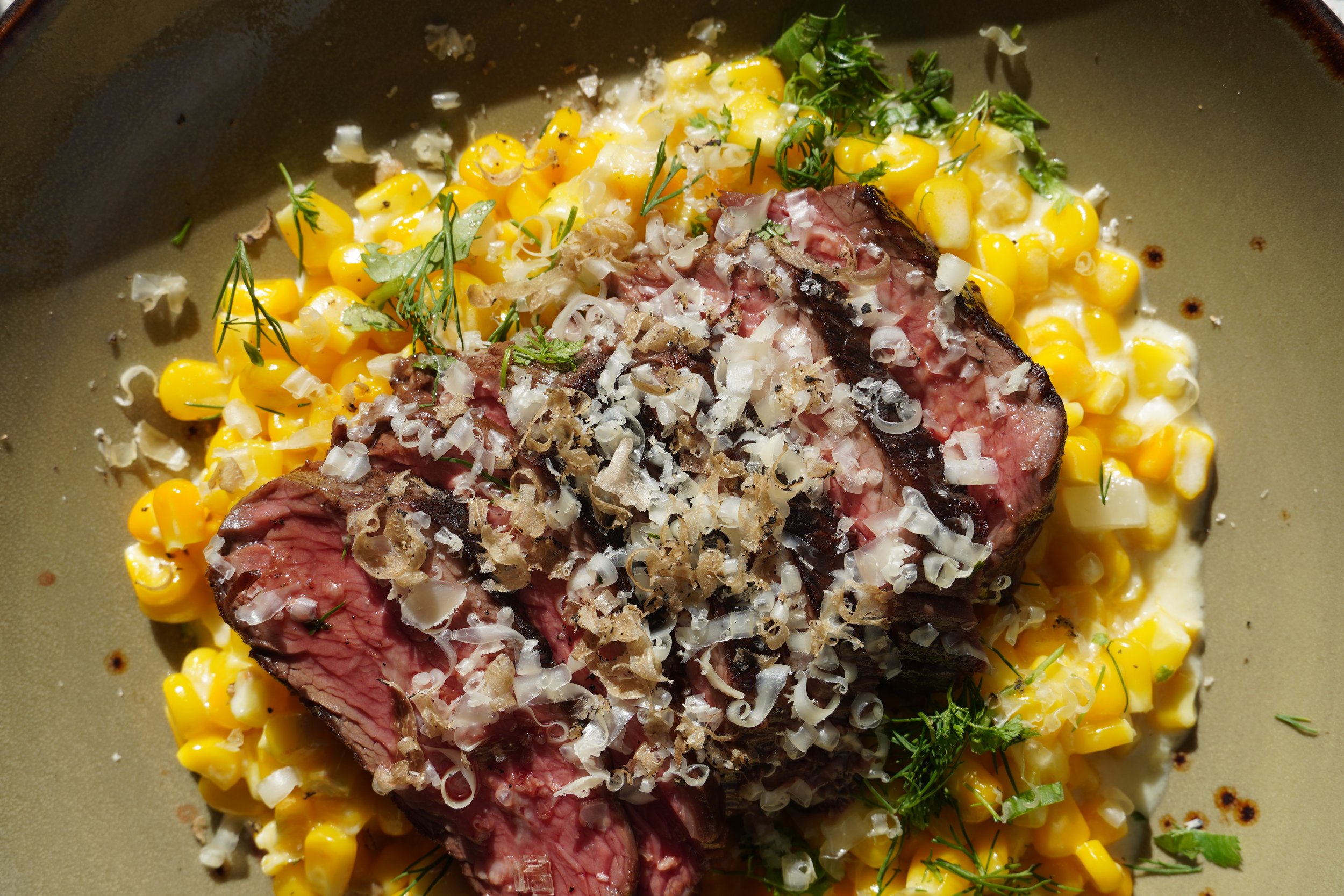 Grass-fed steak from Boyden Farm Beef with seasonal corn at Cork Restaurant — chef-driven farm-to-table dining in Stowe, Vermont
