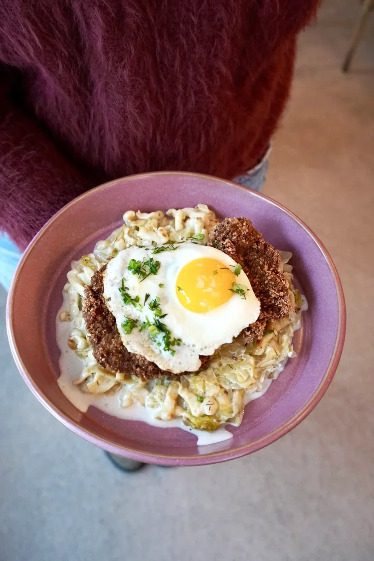 Chicken schnitzel with Spätzle and a farm egg at Cork Restaurant — locally sourced ingredients in Stowe, Vermont