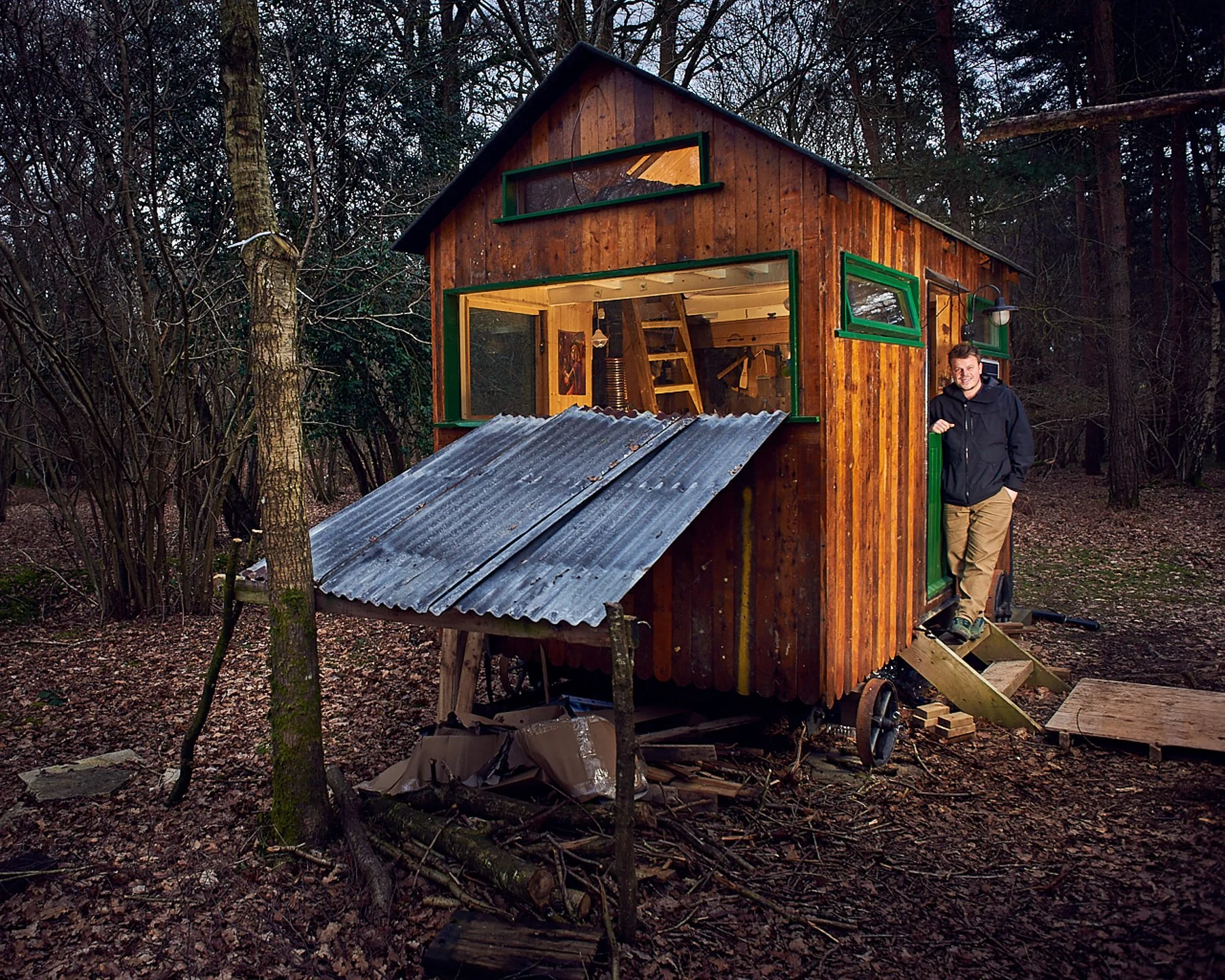 Dave Erasmus social entrepreneur standing beside a shepherd's hut