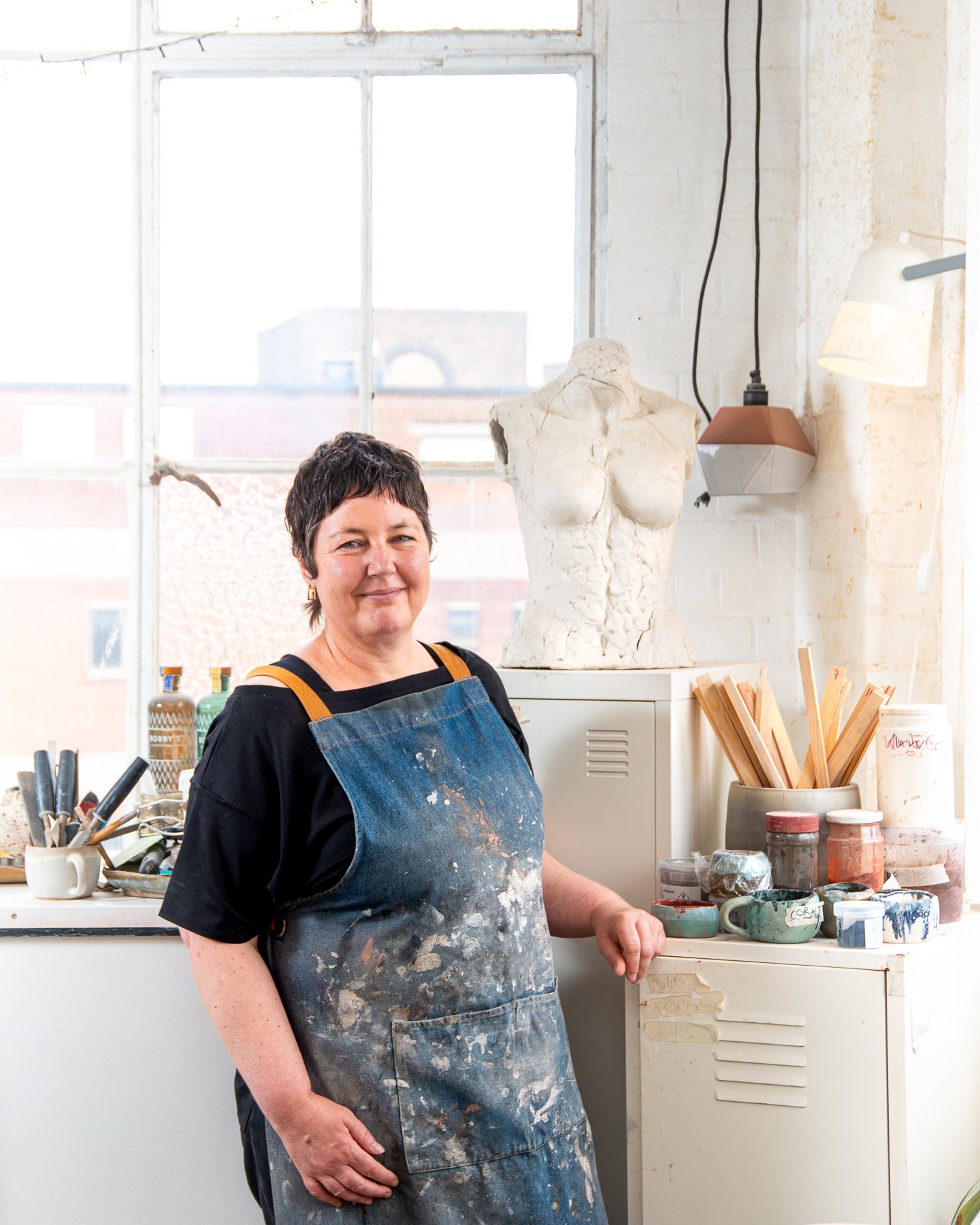 Martha working in her ceramics studio in Wood Green London
