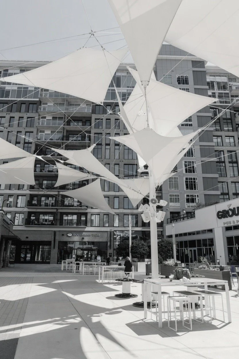 Modern mixed-use commercial development with outdoor plaza, retail, and office space in Upstate South Carolina representing Castle Property Group's property management and commercial real estate services.