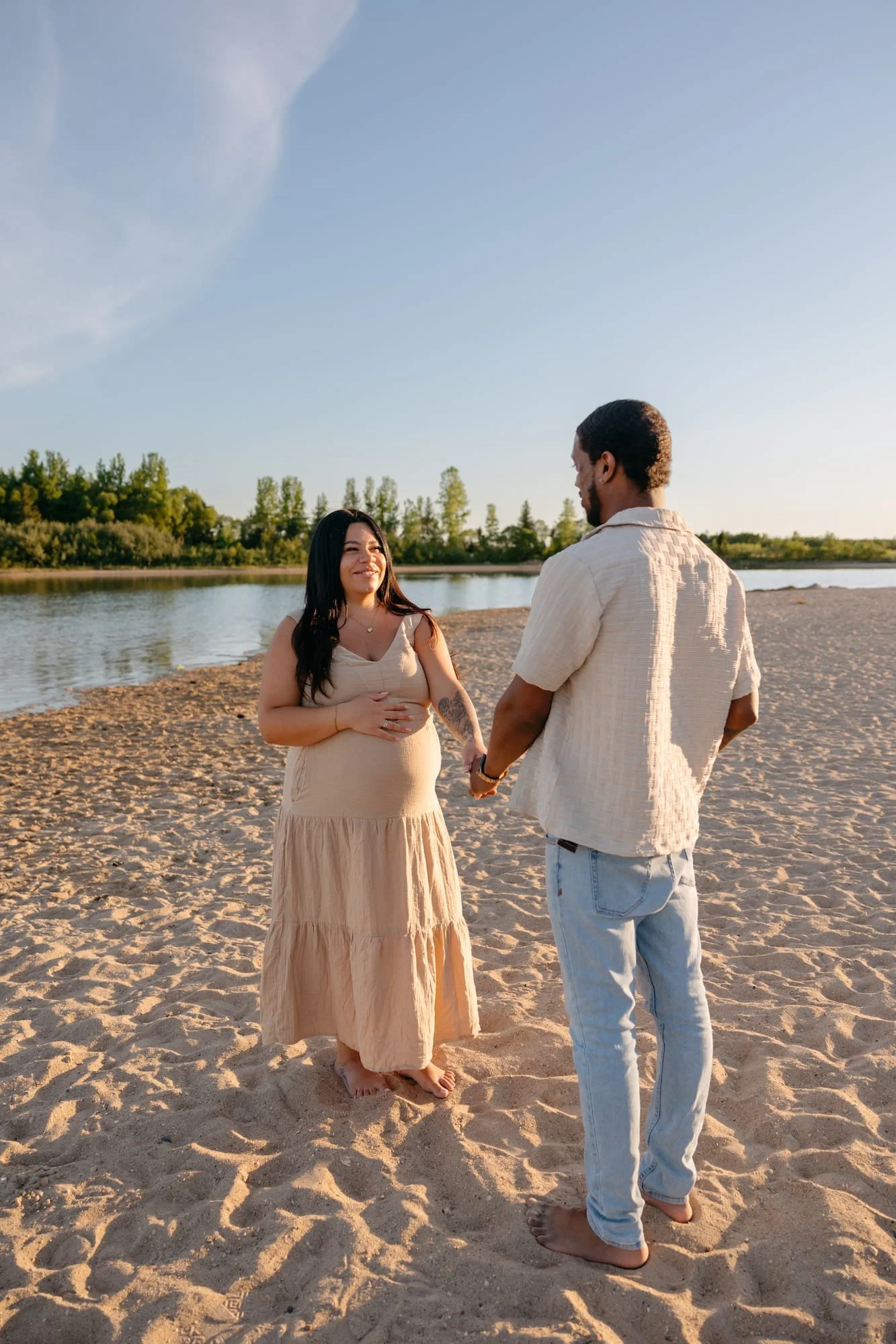 Birds-Hill-Beach-Maternity-Photos-Winnipeg-Couple-Holding-Hands
