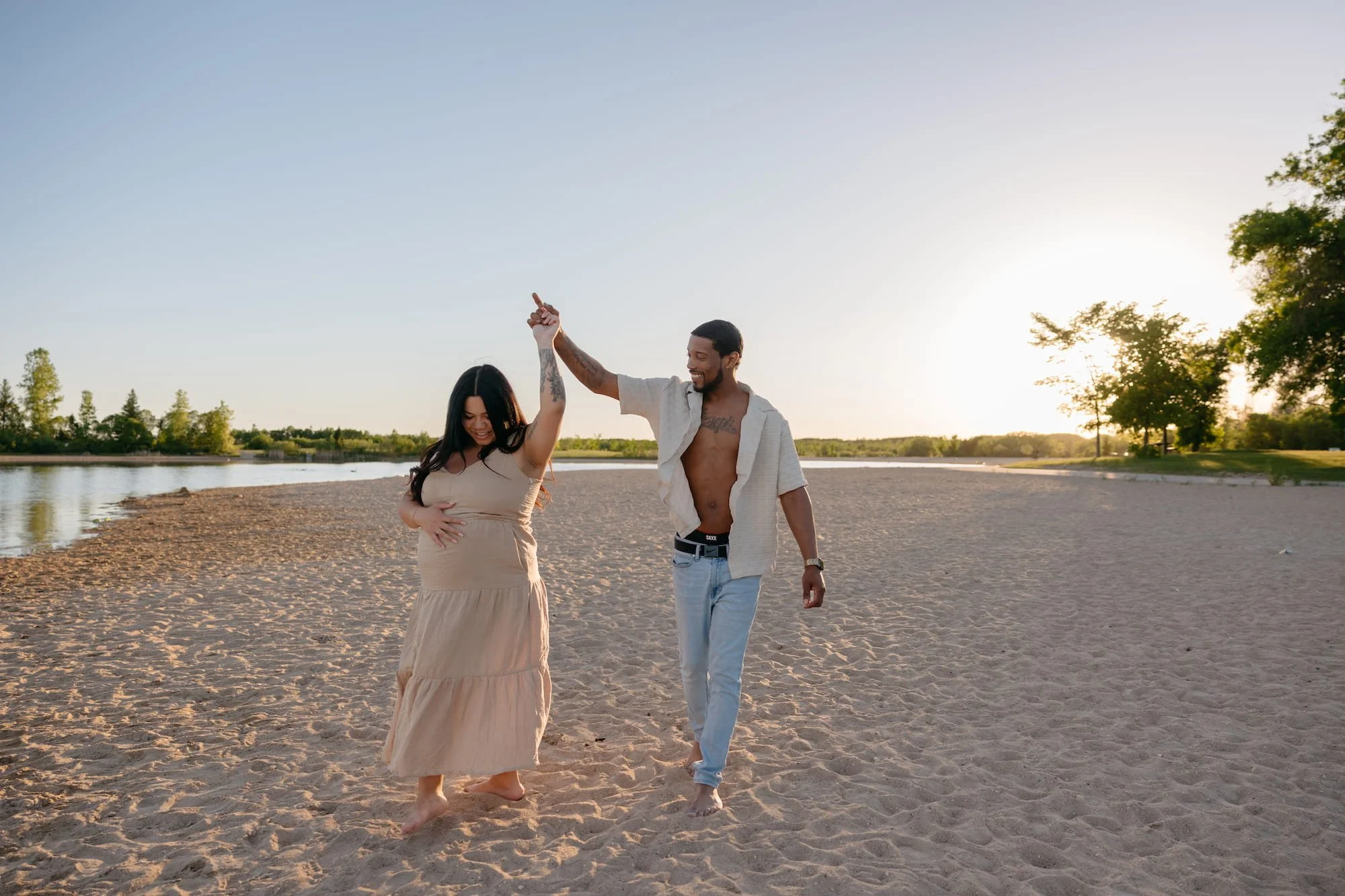 playful-beach-maternity-couple-photos-winnipeg