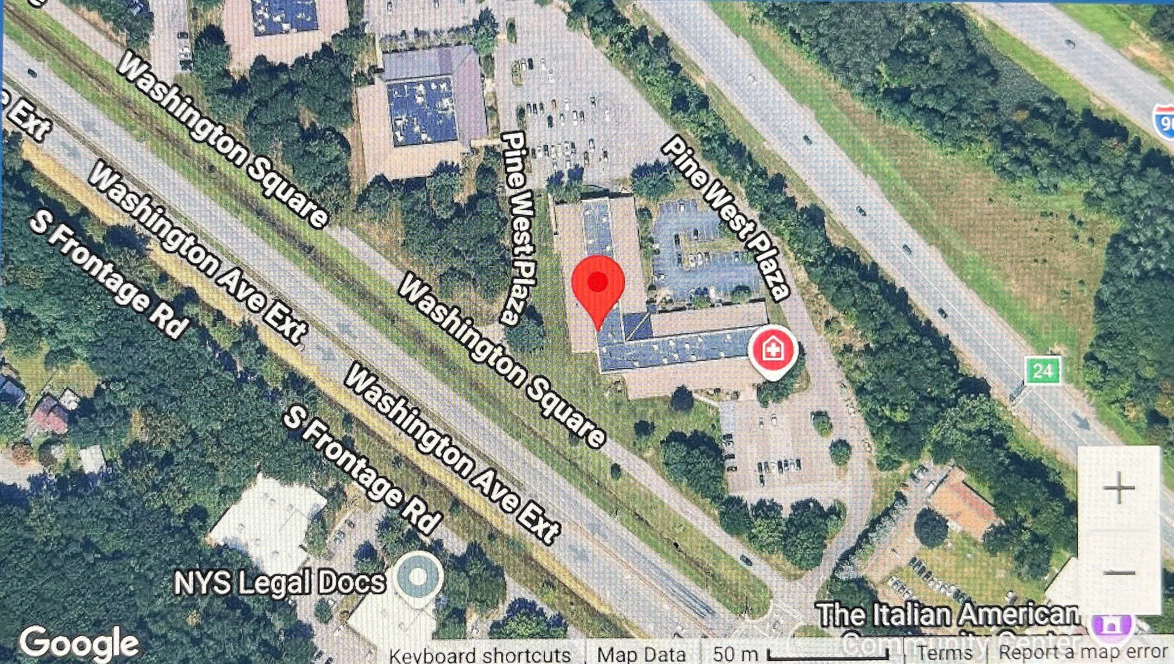 An aerial map view showing streets labeled Washington Square, Pine View West Plaza, Pine View, and Washington Avenue Ext, with a building and parking lot, near highways I-95 and Route 24. Nearby locations include NYS Legal Dogs and The Italian American.