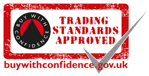 A red and white stamp-like graphic with the text 'Trading Standards Approved' and a black gauge icon with the words 'Buy With Confidence.' The website buywithconfidence.gov.uk is at the bottom.