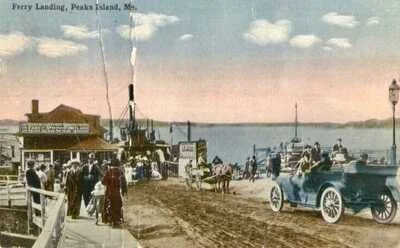 Vintage black-and-white photo of ferry landing on Peaks Island, Maine, showing people walking, horse-drawn carriages, and early automobiles near a dock with a boat.