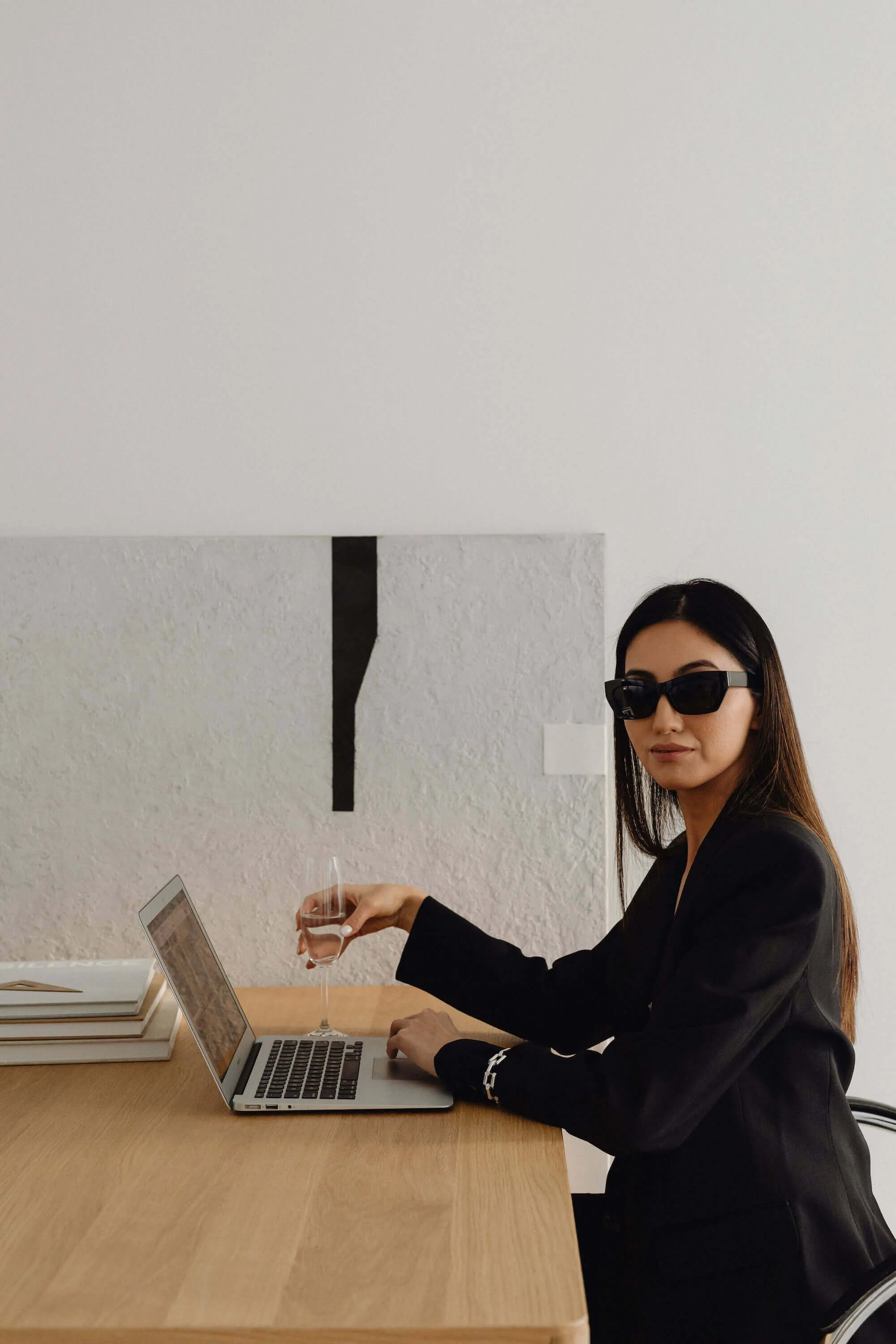 kaboompics_dark-classy-aesthetic-fashion-beautiful-asian-female-entrepreneur-in-black-suit-technology-and-devices-iphone-laptop-airpods-30045 (1).jpg