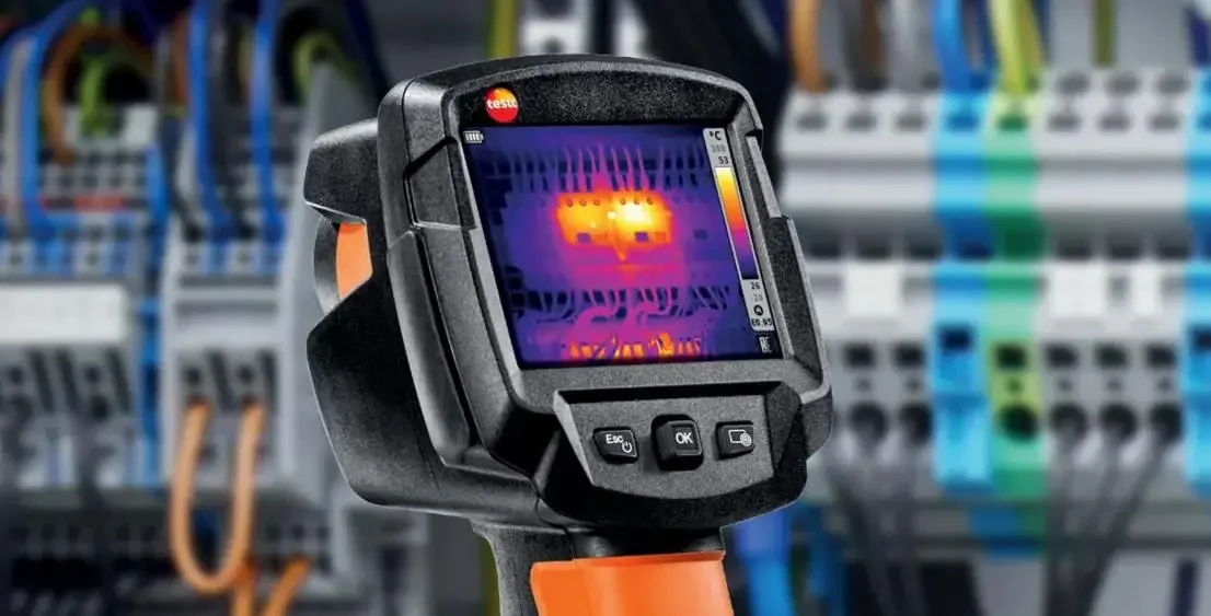 Infrared thermal image of electrical circuit breakers and wiring in an electrical panel.