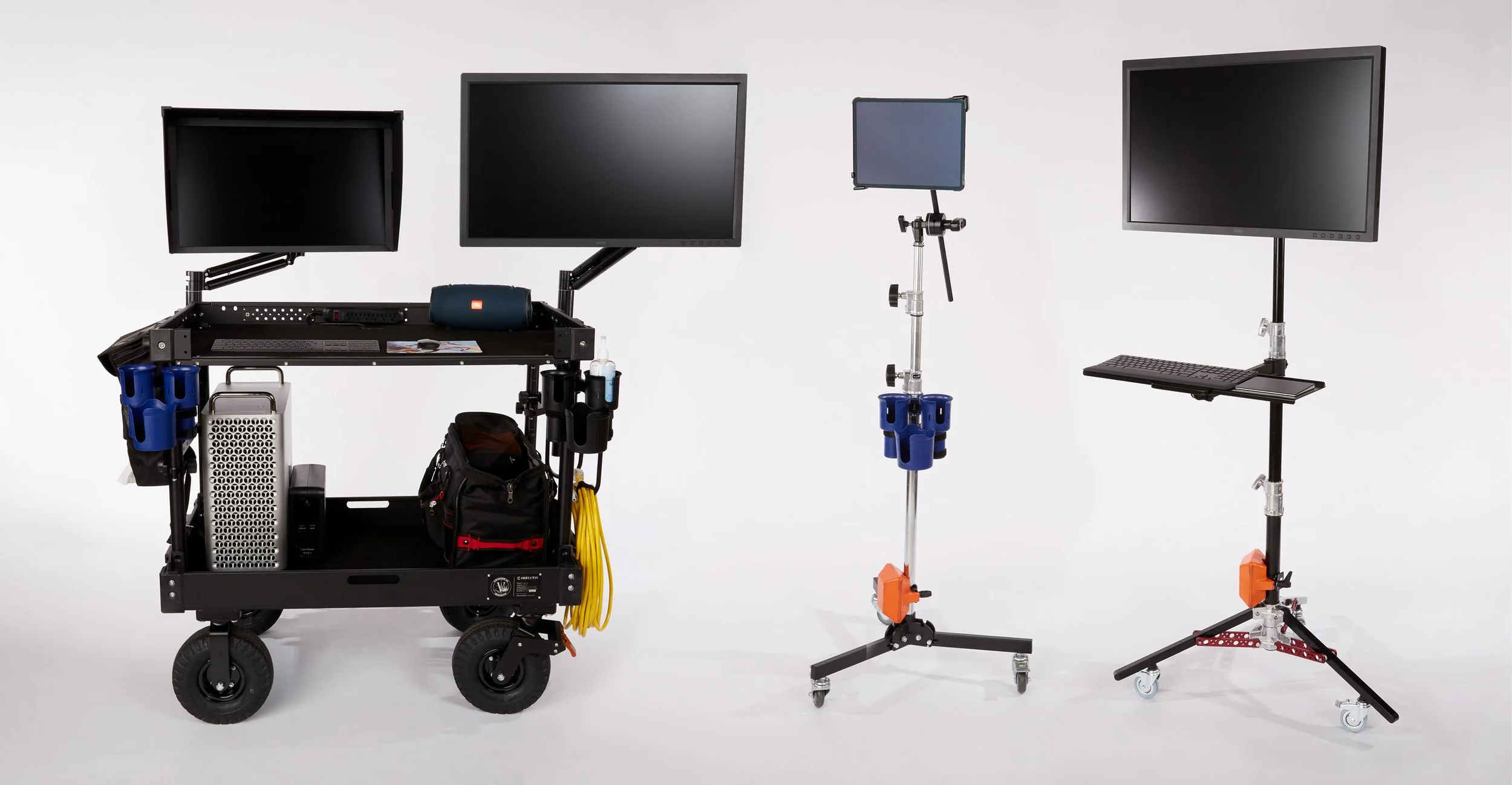 Two monitor carts with multiple screens, one with a black frame and one smaller, on white background. Andrew Fornasier Digital Tech San Francisco