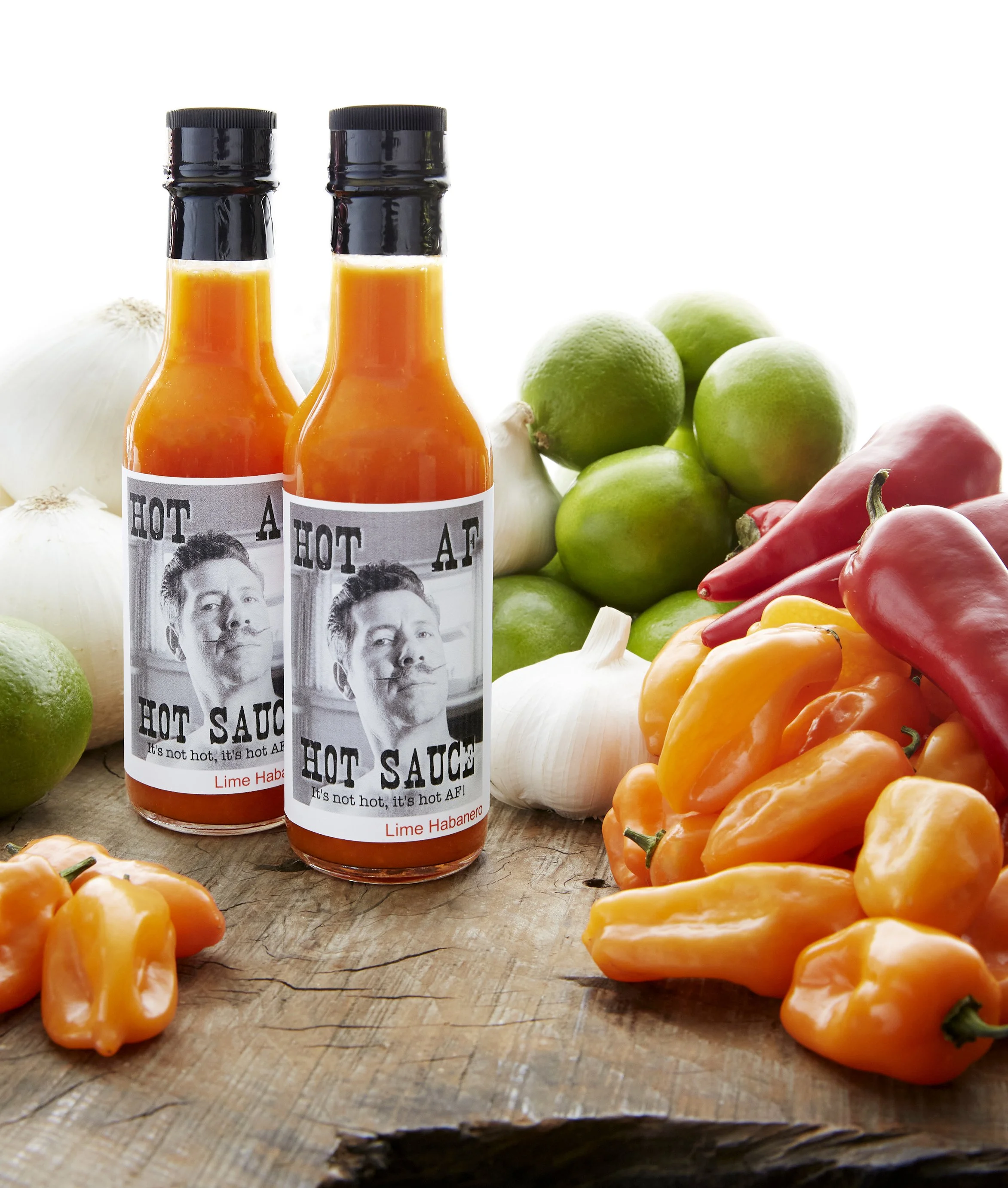Two bottles of hot sauce labeled "A Hot Sauce" The Original Hot AF Sauce Andrew Fornasier Digital Tech San Francisco