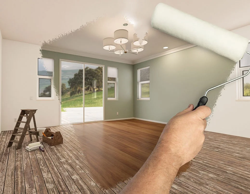 Digital rendering of painting a room with wood floor, light green walls, and windows, with a paint roller in hand.