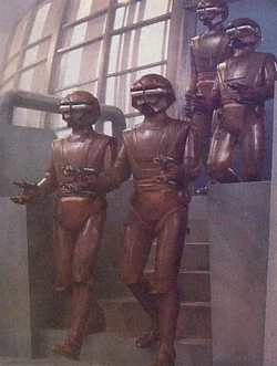 Three bronze statues of soldiers wearing military uniforms and helmets, holding rifles, positioned in front of a large window.